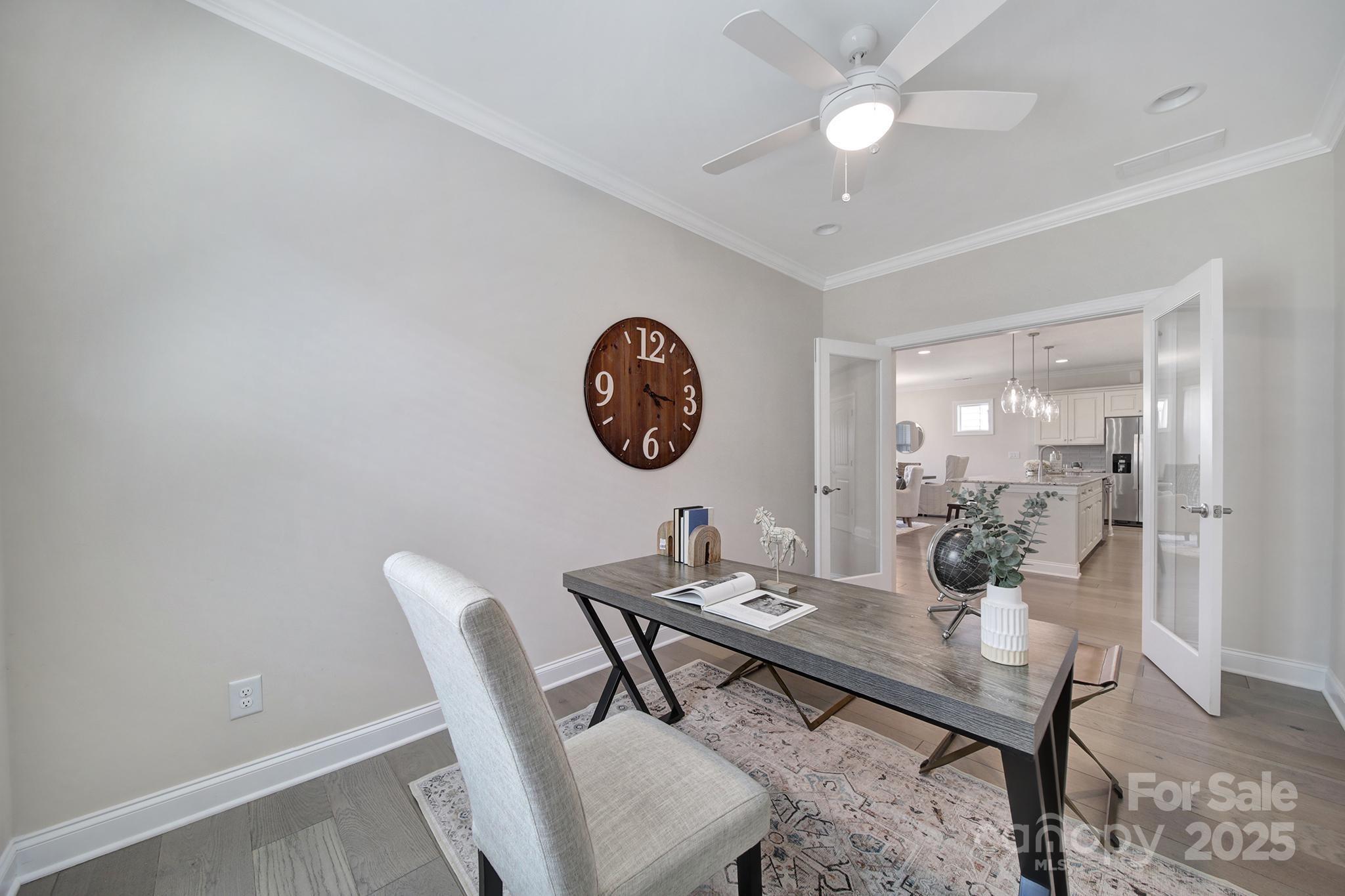 6255 Scuttle Lane, Unit 1104 Denver, NC 28037 - Photo 12 of 45 a view of a dining room with furniture and wooden floor