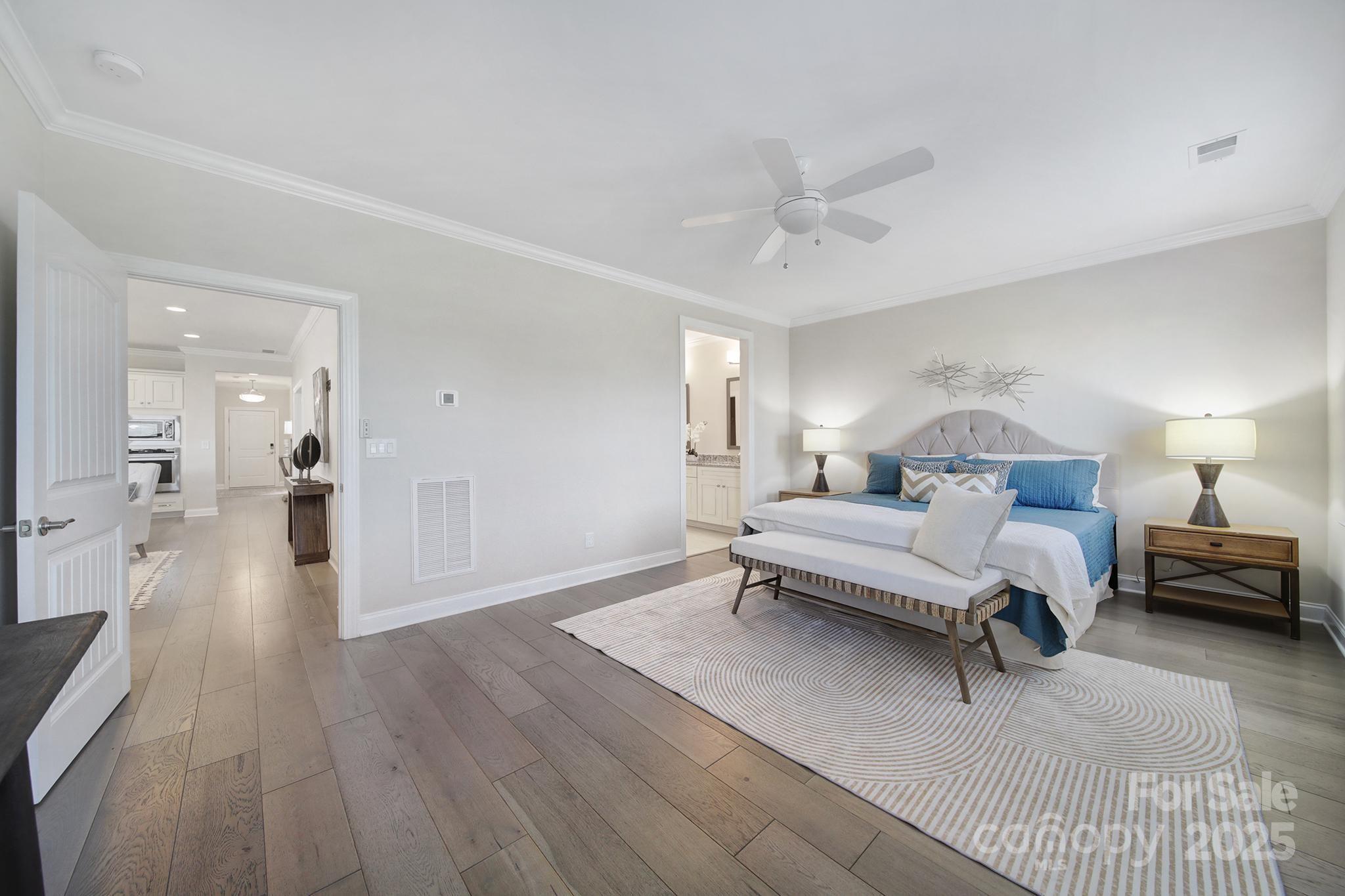 6255 Scuttle Lane, Unit 1104 Denver, NC 28037 - Photo 14 of 45 a living room with furniture and a wooden floor