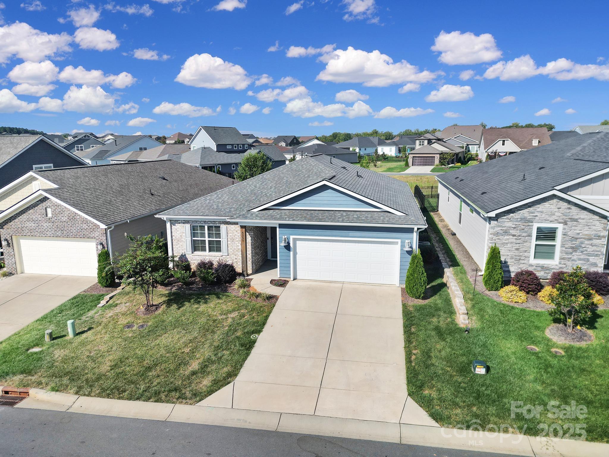 6255 Scuttle Lane, Unit 1104 Denver, NC 28037 - Photo 28 of 45 front view of a house with a yard