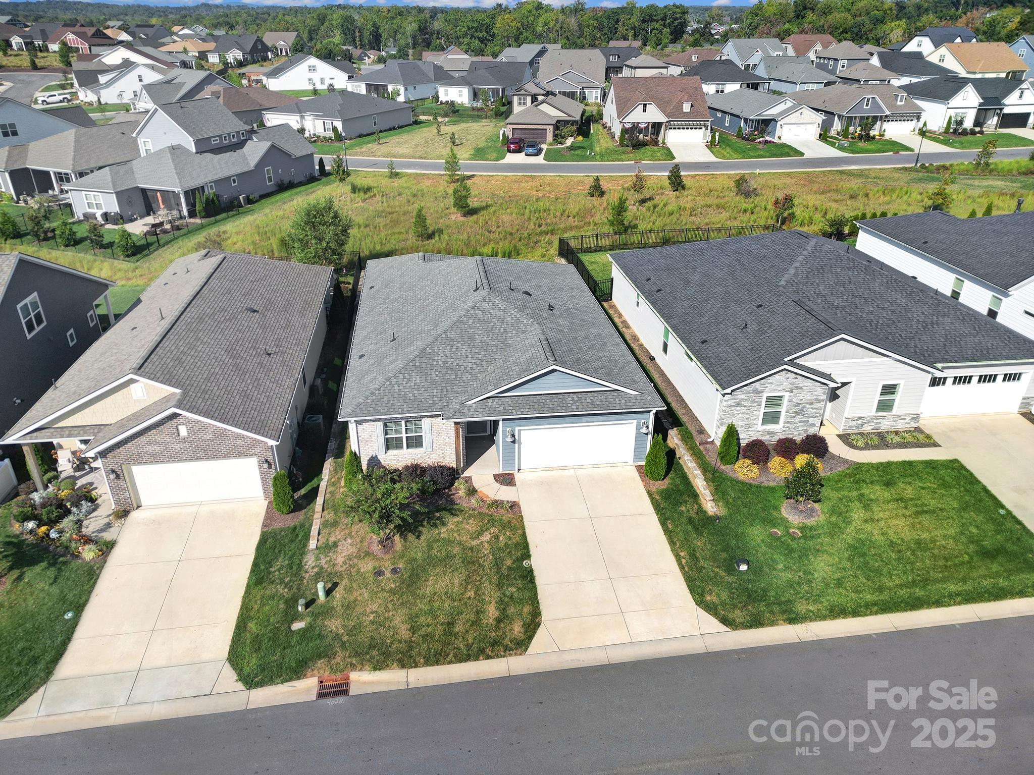 6255 Scuttle Lane, Unit 1104 Denver, NC 28037 - Photo 29 of 45 an aerial view of residential houses with outdoor space and parking