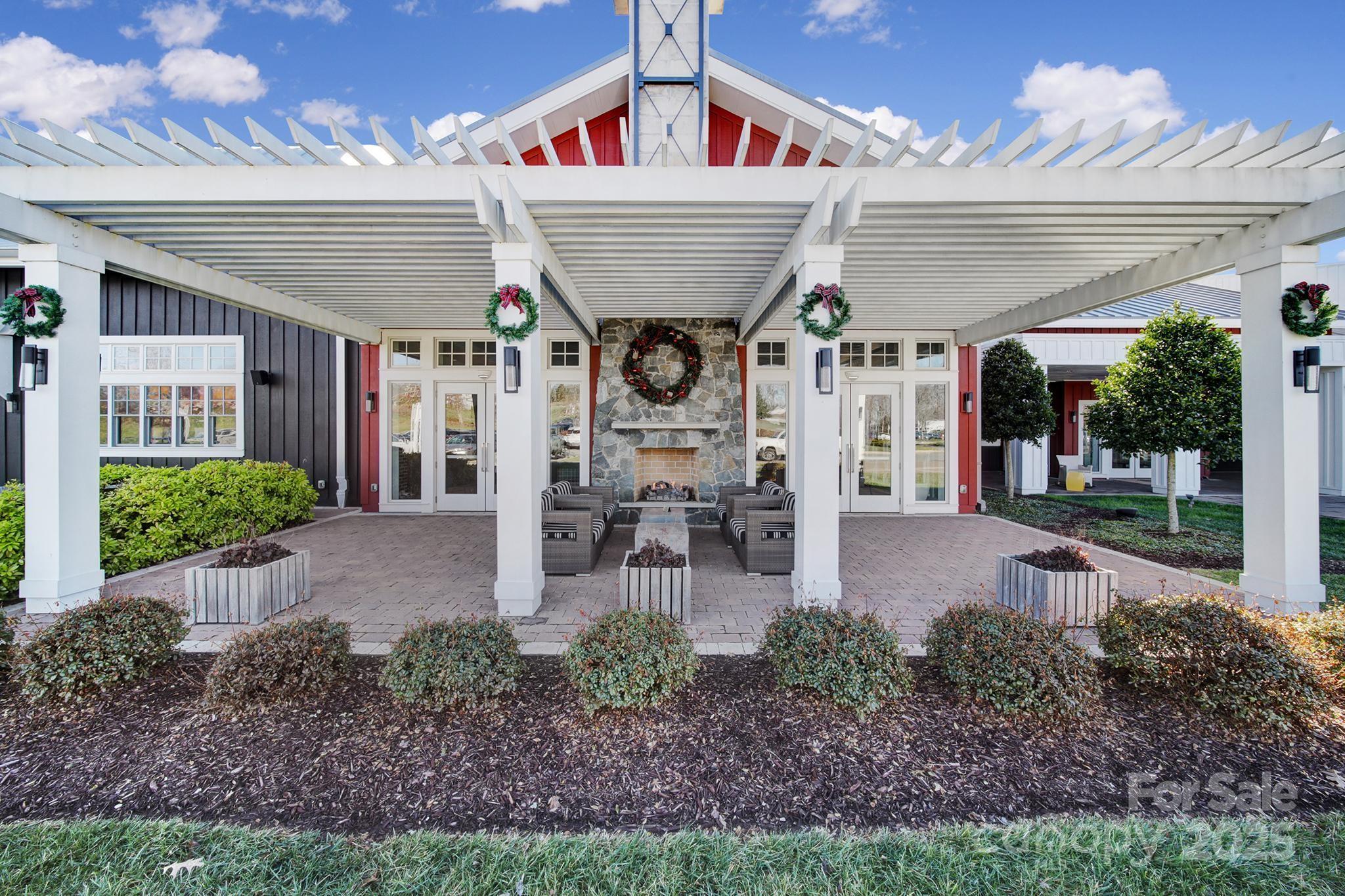 6255 Scuttle Lane, Unit 1104 Denver, NC 28037 - Photo 33 of 45 a view of a chairs and table in backyard of the house