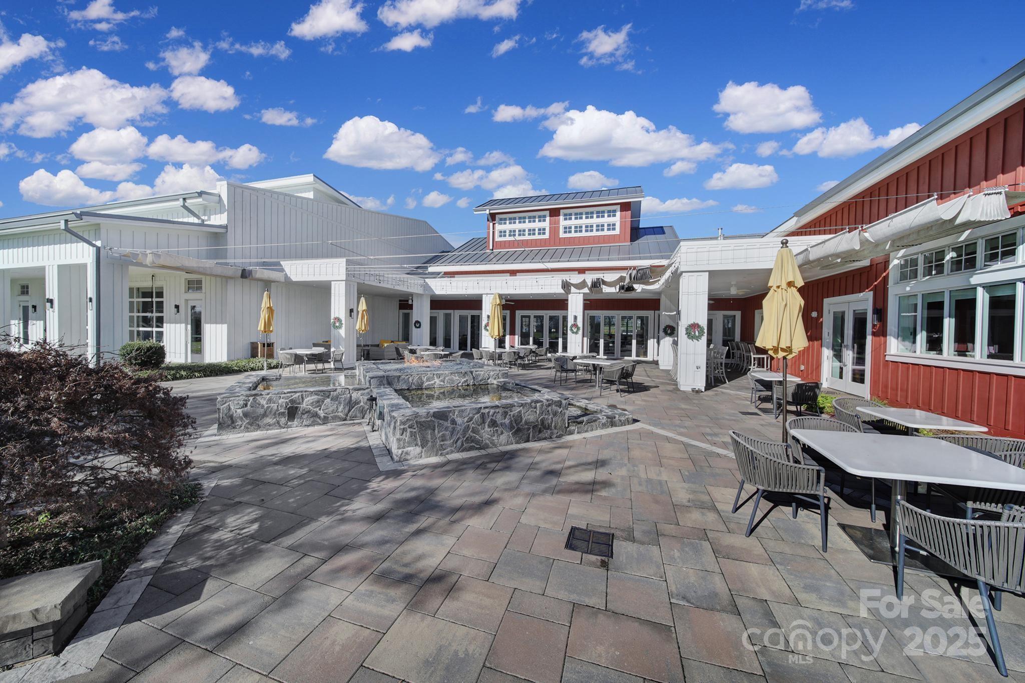 6255 Scuttle Lane, Unit 1104 Denver, NC 28037 - Photo 34 of 45 a view of a chairs and tables in the patio
