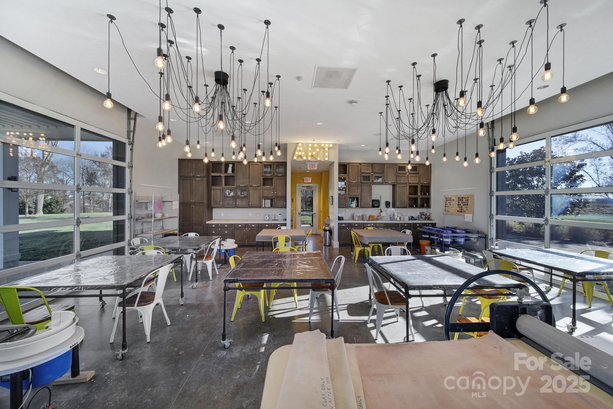 6255 Scuttle Lane, Unit 1104 Denver, NC 28037 - Photo 36 of 45 a living room with lots of furniture and chandelier