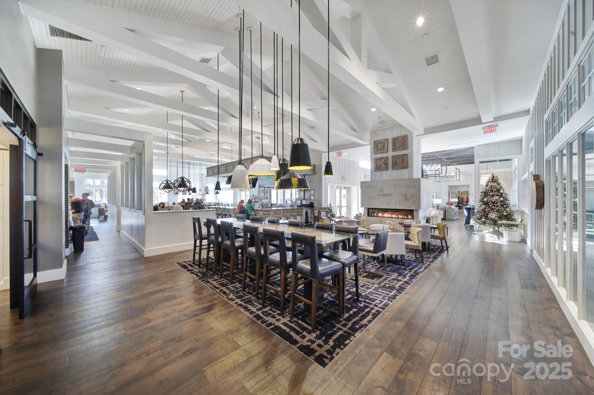 6255 Scuttle Lane, Unit 1104 Denver, NC 28037 - Photo 37 of 45 a large room with lots of wooden furniture