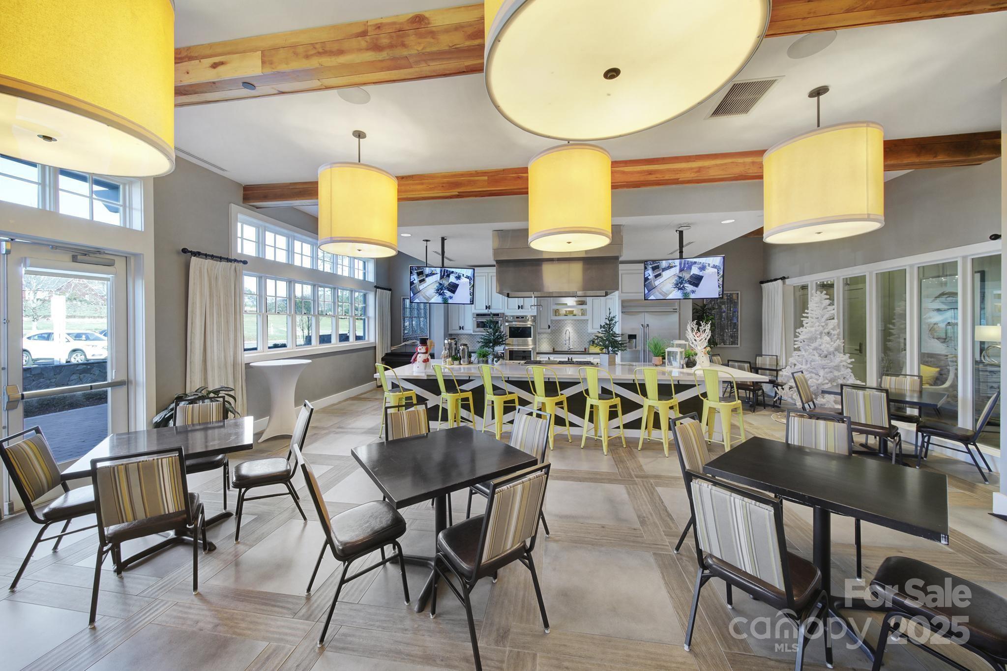 6255 Scuttle Lane, Unit 1104 Denver, NC 28037 - Photo 38 of 45 a view of a dining room with furniture and chandelier