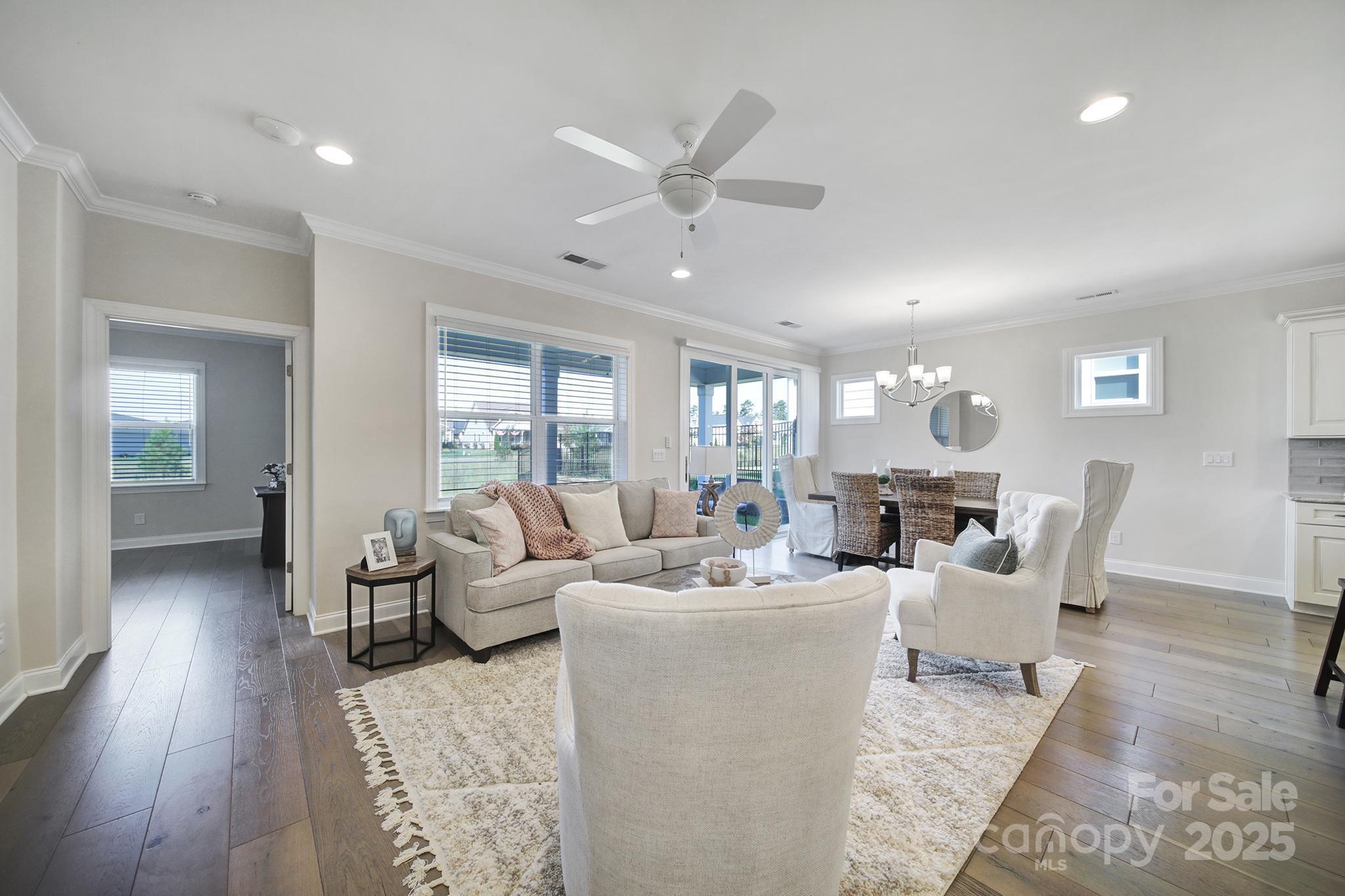 6255 Scuttle Lane, Unit 1104 Denver, NC 28037 - Photo 7 of 45 a living room with furniture and wooden floor