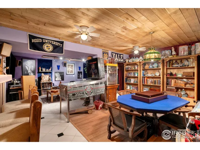 a living room with lots of furniture and a large window