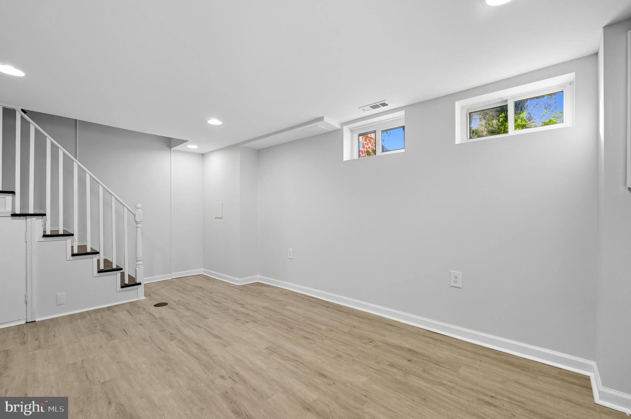 5768 Maplehill Road Baltimore, MD 21239 - Photo 11 of 29 a view of an empty room with wooden floor
