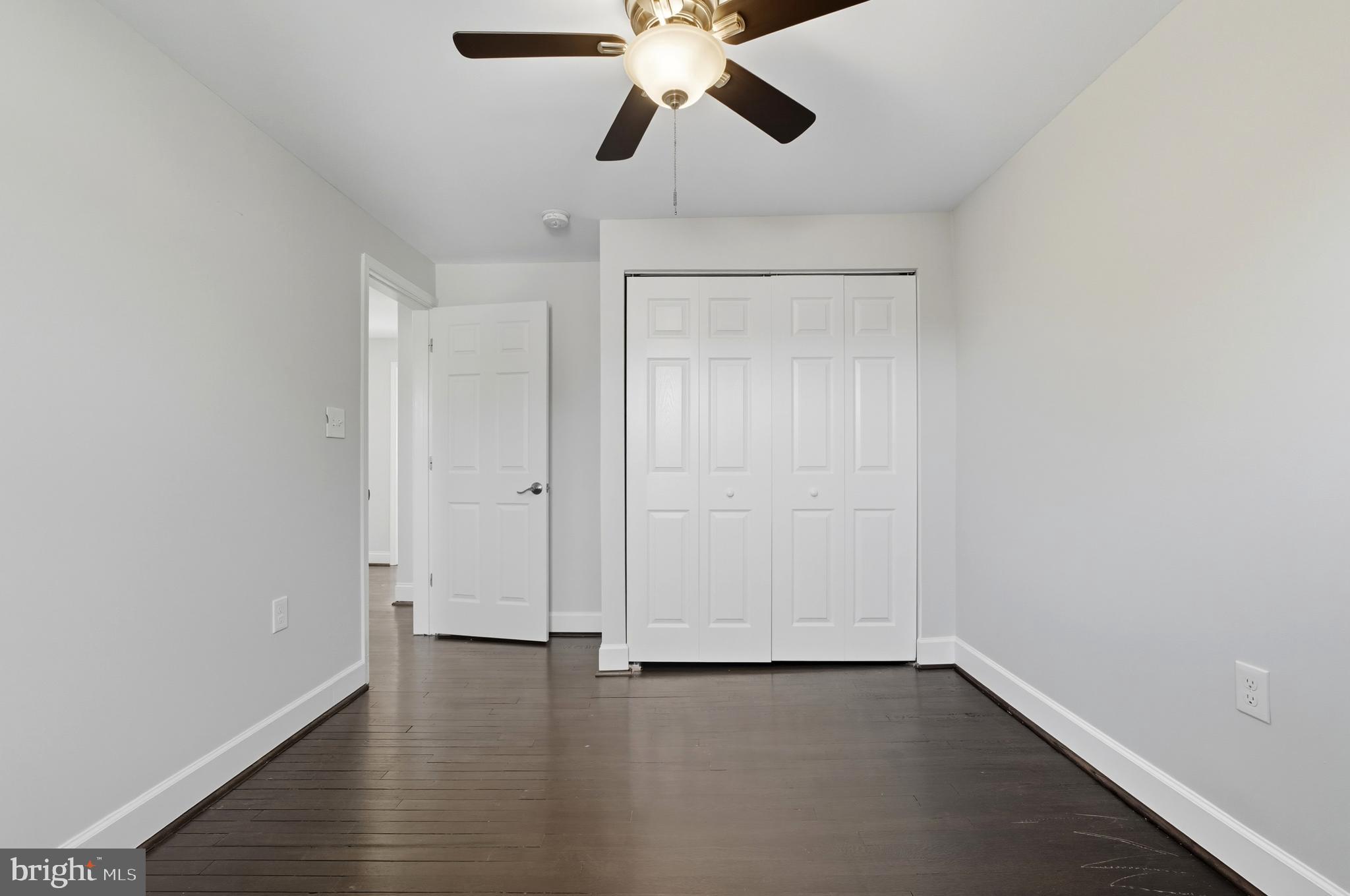 5768 Maplehill Road Baltimore, MD 21239 - Photo 18 of 29 a view of an empty room and wooden floor