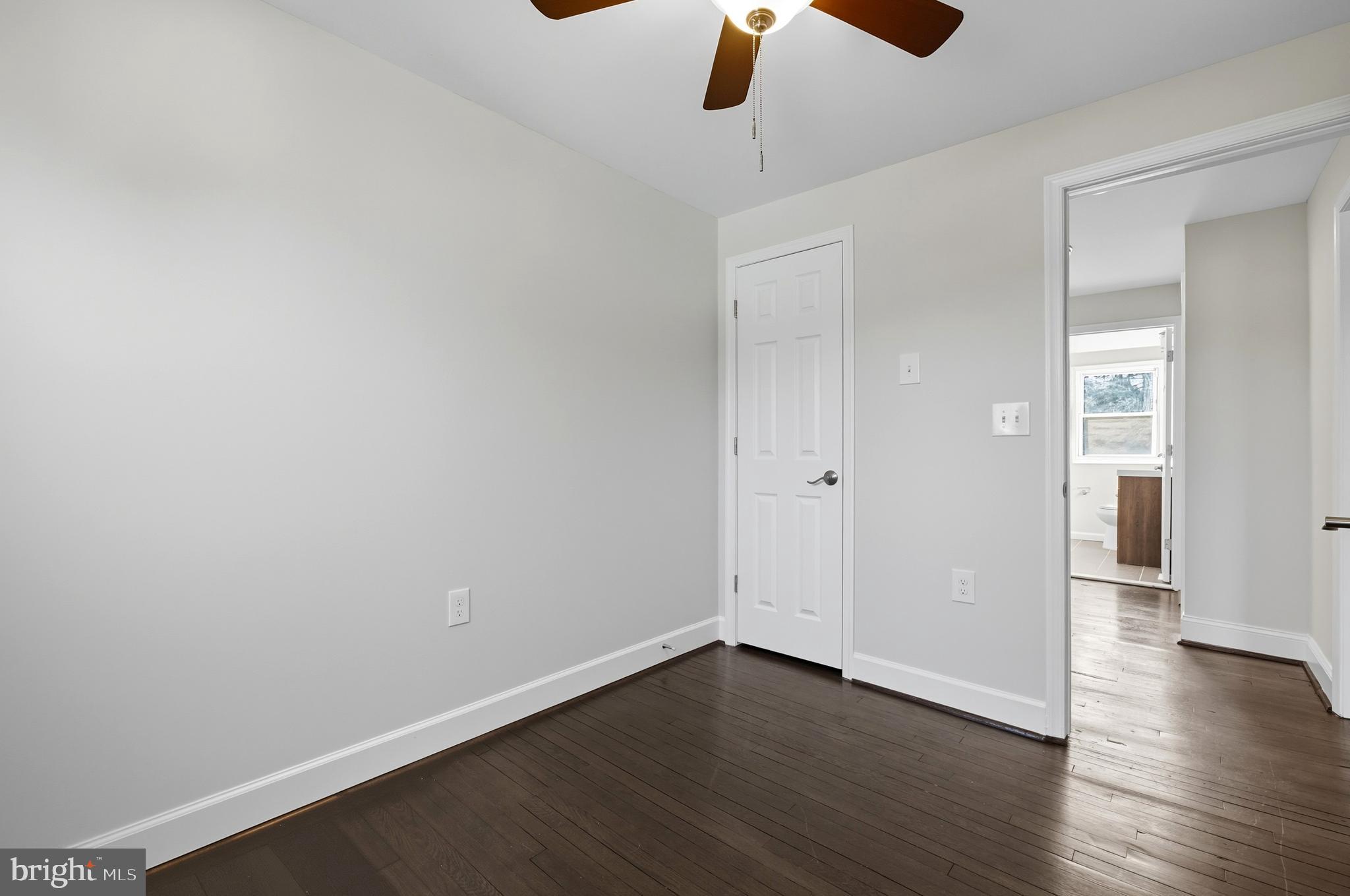 5768 Maplehill Road Baltimore, MD 21239 - Photo 20 of 29 wooden floor in an empty room