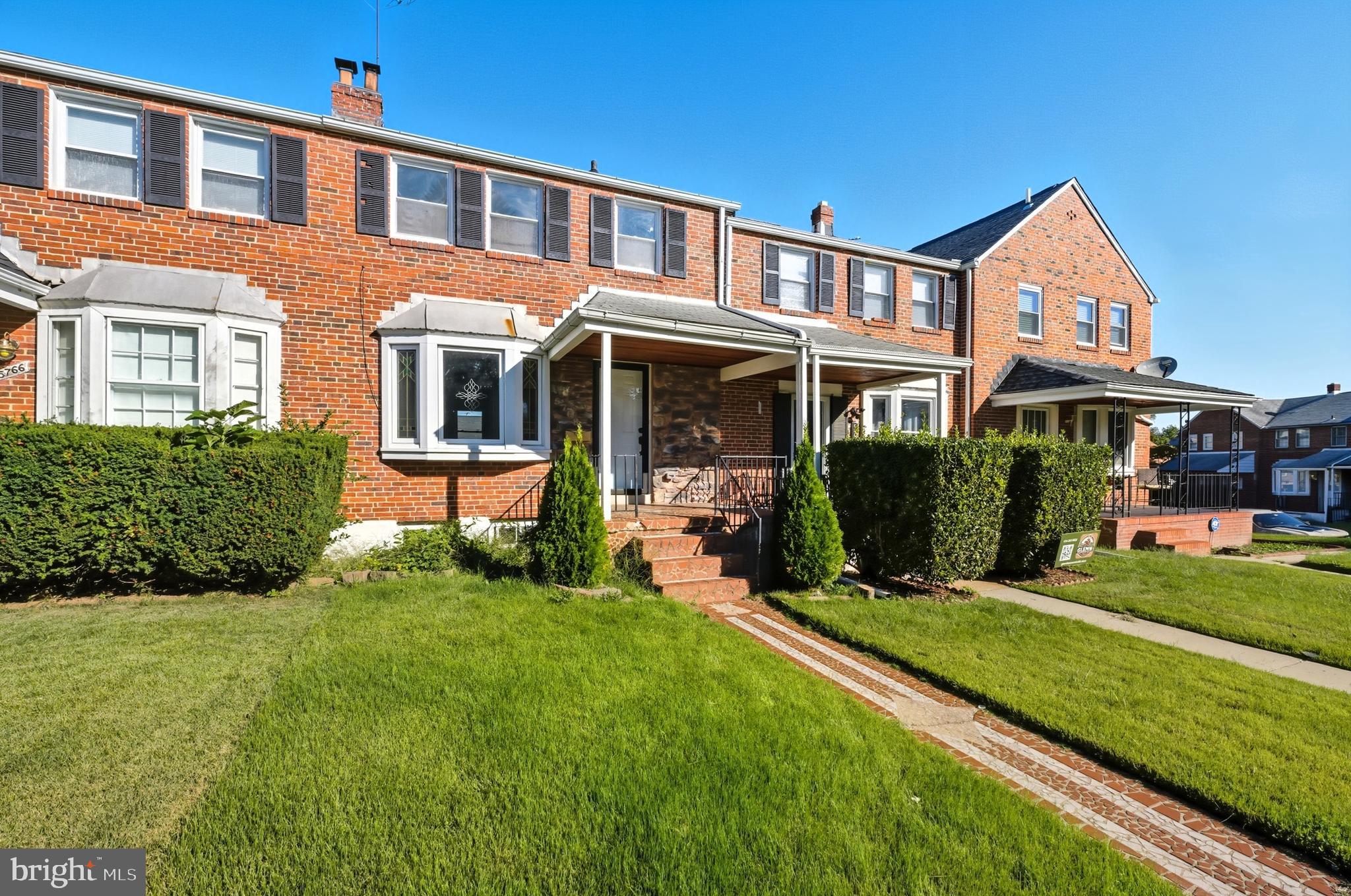 5768 Maplehill Road Baltimore, MD 21239 - Photo 26 of 29 a front view of a house with a yard