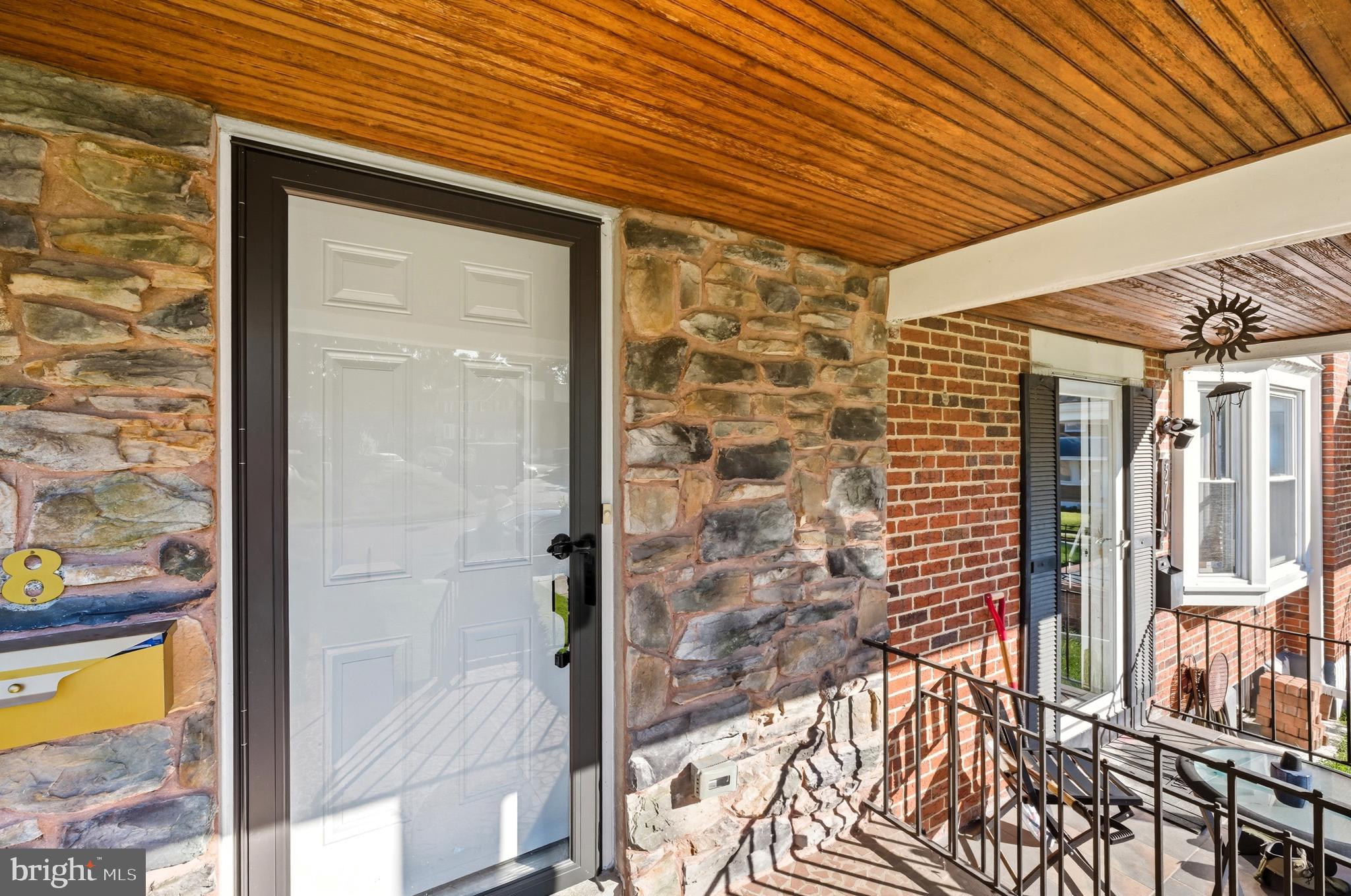 5768 Maplehill Road Baltimore, MD 21239 - Photo 29 of 29 a front view of a house with a glass door