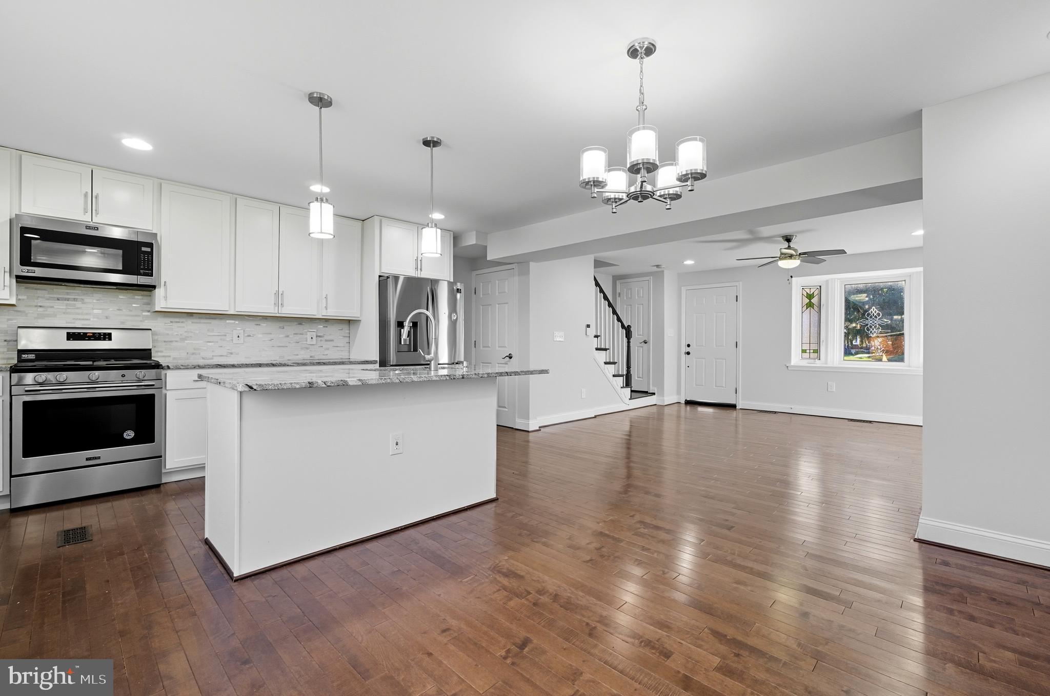 5768 Maplehill Road Baltimore, MD 21239 - Photo 9 of 29 a view of a kitchen with marble kitchen and stainless steel appliances