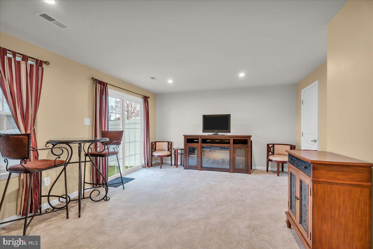 204 Freedom Way Sicklerville, NJ 08081 - Photo 12 of 32 a view of a livingroom with furniture and a flat screen tv