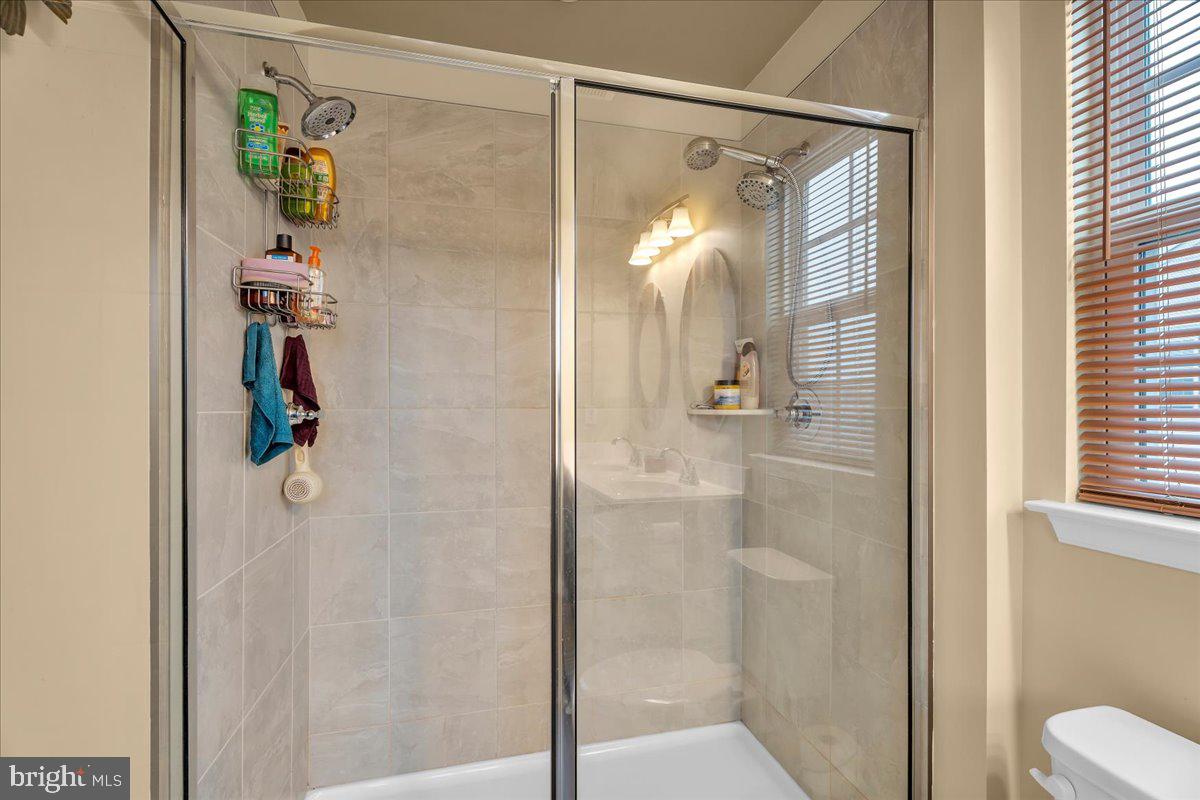 204 Freedom Way Sicklerville, NJ 08081 - Photo 16 of 32 a bathroom with a shower and a sink