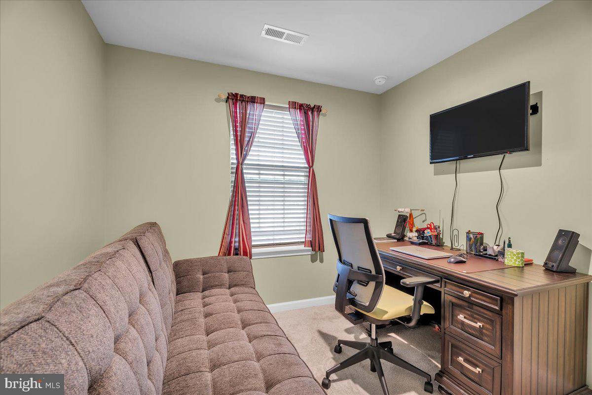 204 Freedom Way Sicklerville, NJ 08081 - Photo 19 of 32 a workspace with furniture and a flat screen tv