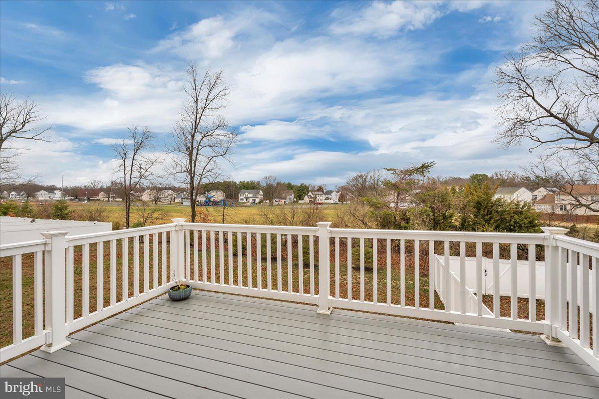 204 Freedom Way Sicklerville, NJ 08081 - Photo 20 of 32 a view of balcony with wooden floor & fence