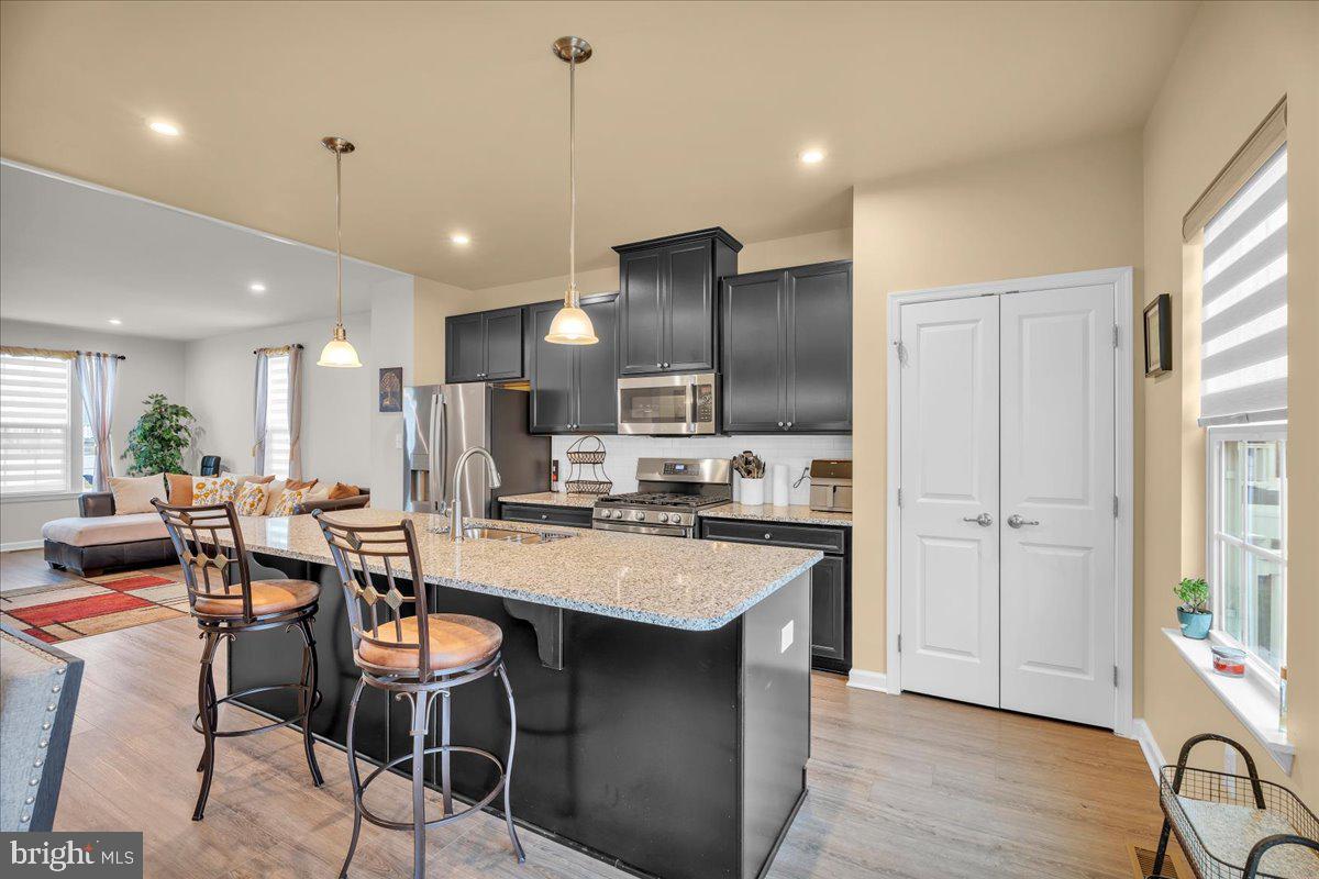 204 Freedom Way Sicklerville, NJ 08081 - Photo 9 of 32 a large kitchen with a table and chairs