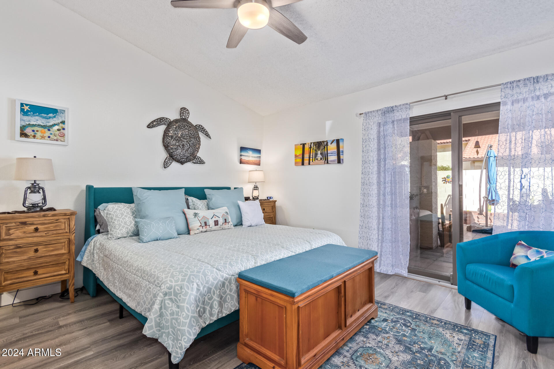 542 South Higley Road, Unit 73 Mesa, AZ 85206 - Photo 12 of 34 a bedroom with a bed and a chandelier