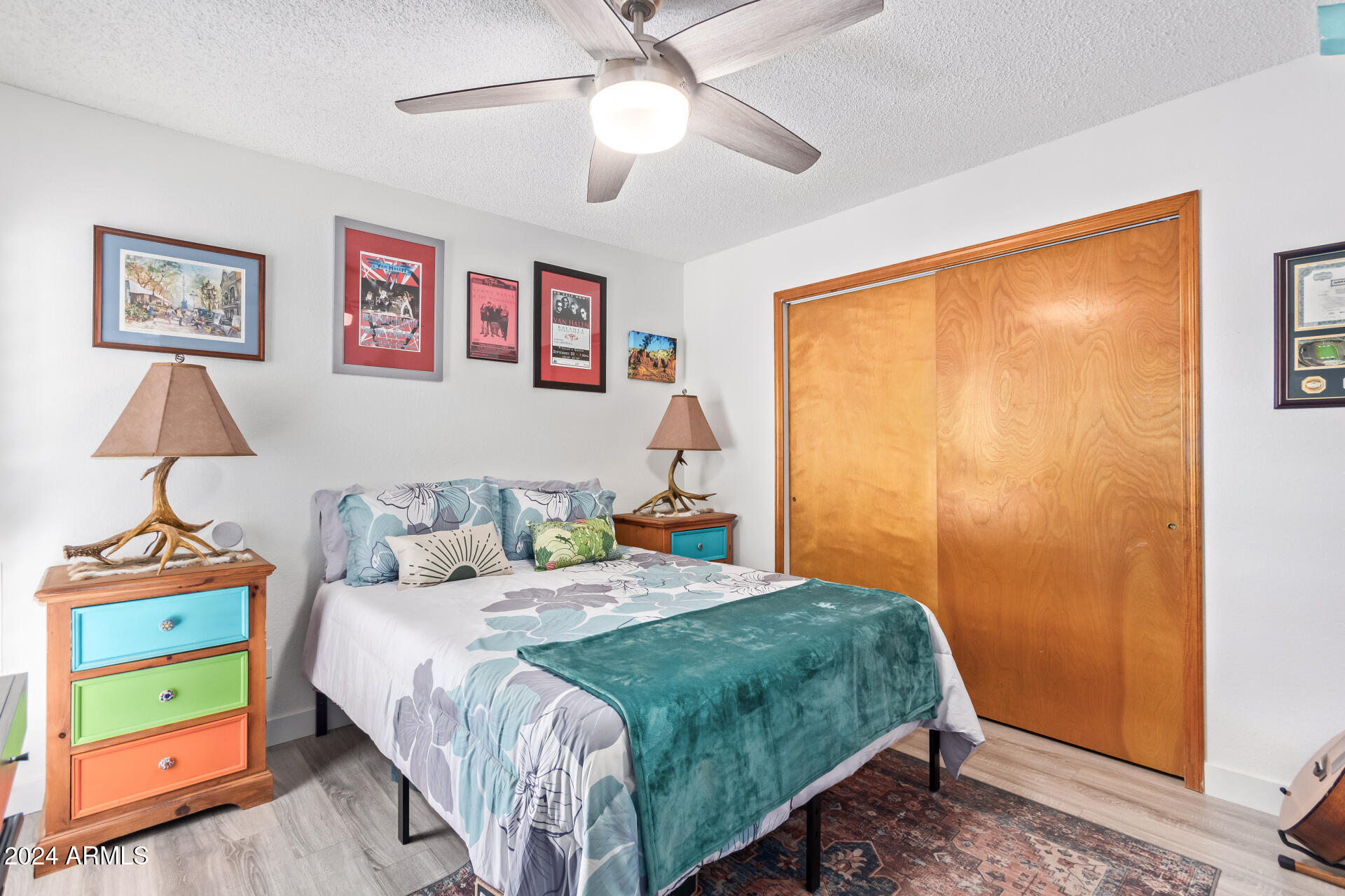 542 South Higley Road, Unit 73 Mesa, AZ 85206 - Photo 16 of 34 a bedroom with a bed and a chandelier