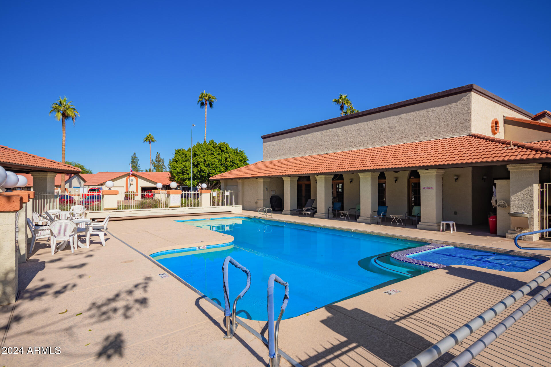 542 South Higley Road, Unit 73 Mesa, AZ 85206 - Photo 23 of 34 a view of a swimming pool with an outdoor seating