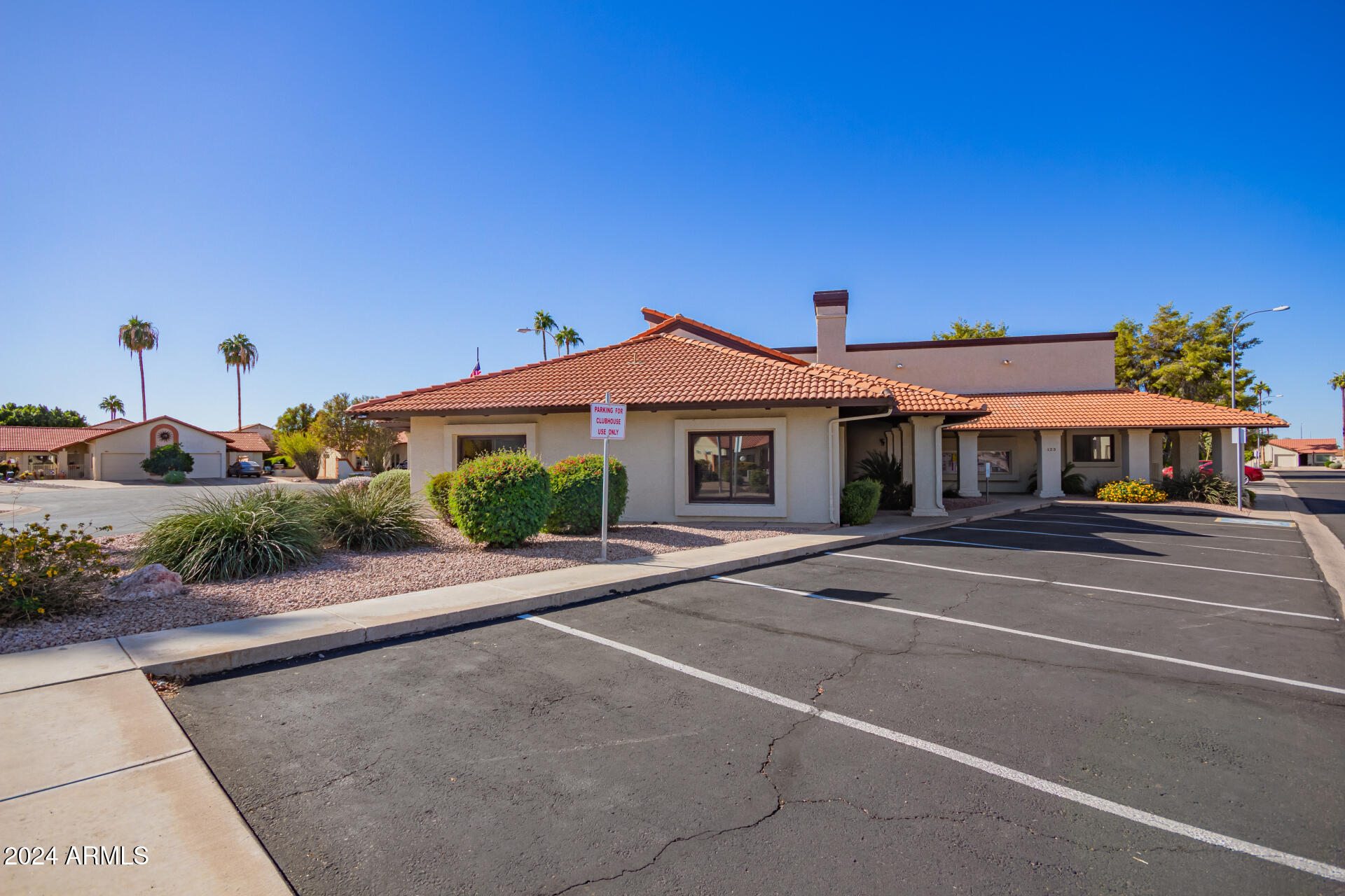 542 South Higley Road, Unit 73 Mesa, AZ 85206 - Photo 31 of 34 a front view of a house with a yard and garage