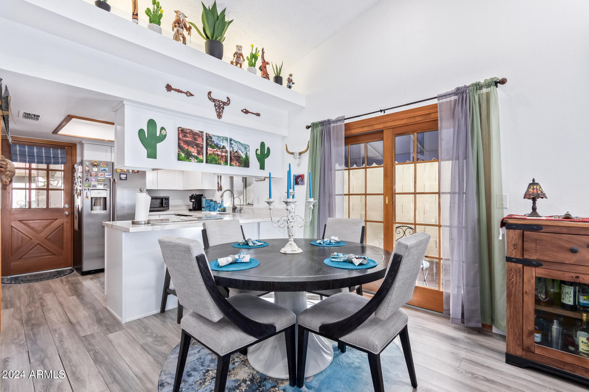 542 South Higley Road, Unit 73 Mesa, AZ 85206 - Photo 5 of 34 a view of a dining room with furniture and wooden floor