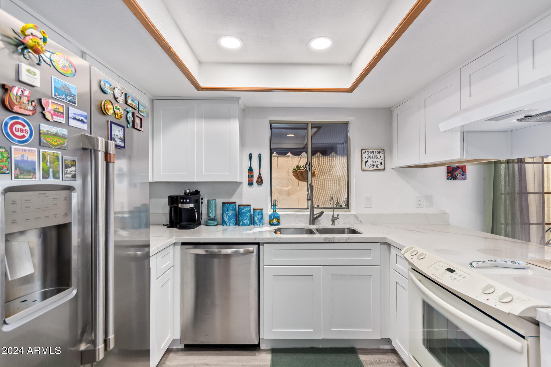 542 South Higley Road, Unit 73 Mesa, AZ 85206 - Photo 9 of 34 a kitchen with stainless steel appliances white cabinets and a sink
