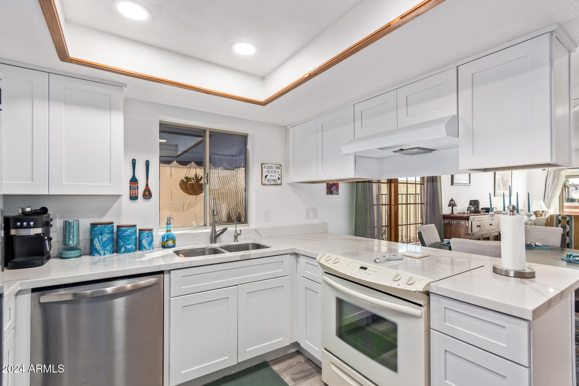 542 South Higley Road, Unit 73 Mesa, AZ 85206 - Photo 10 of 34 a kitchen with a sink stove and cabinets