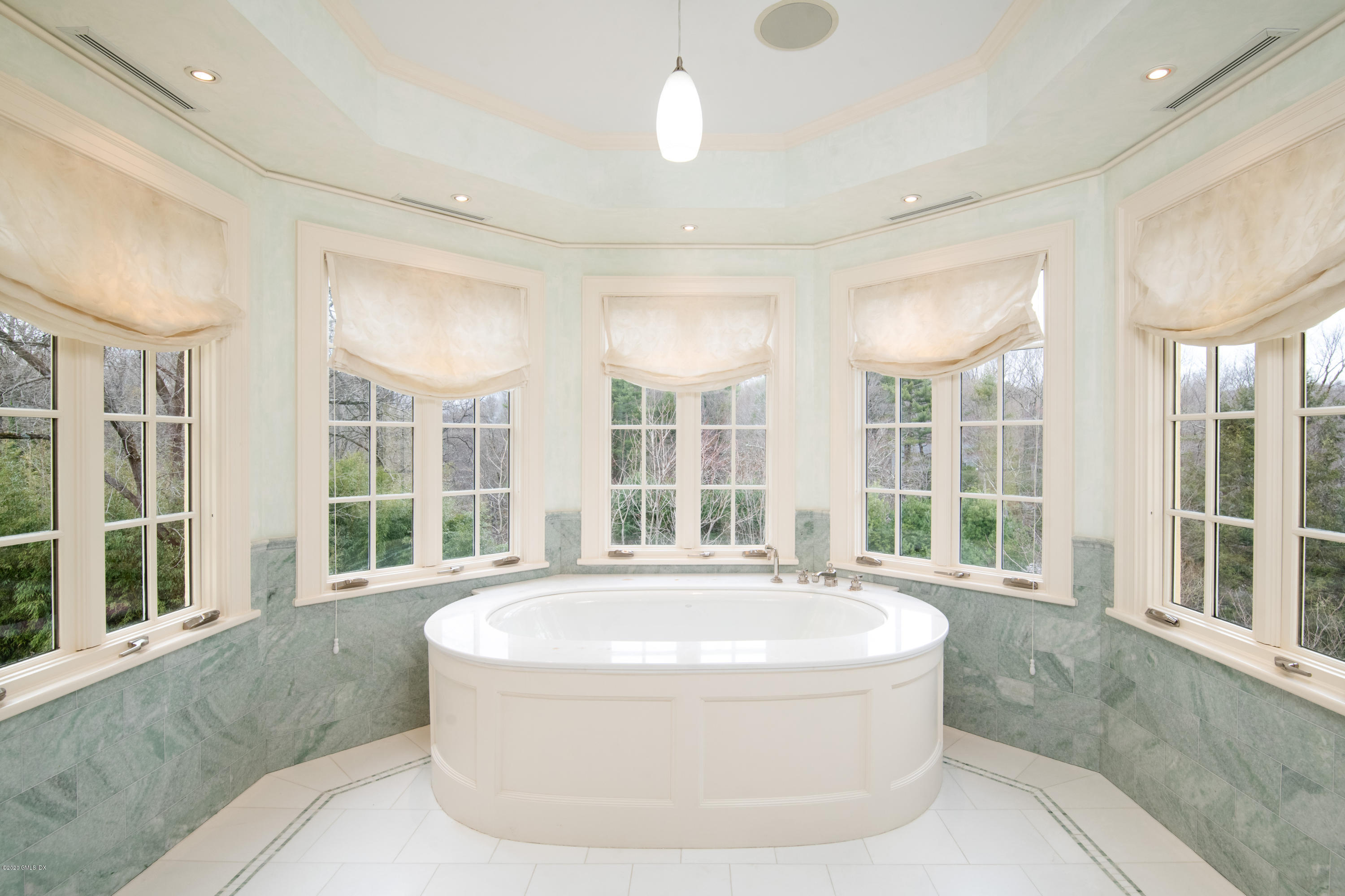 397 Riversville Road Greenwich, CT 06831 - Photo 11 of 21 a living room with large windows and chandelier