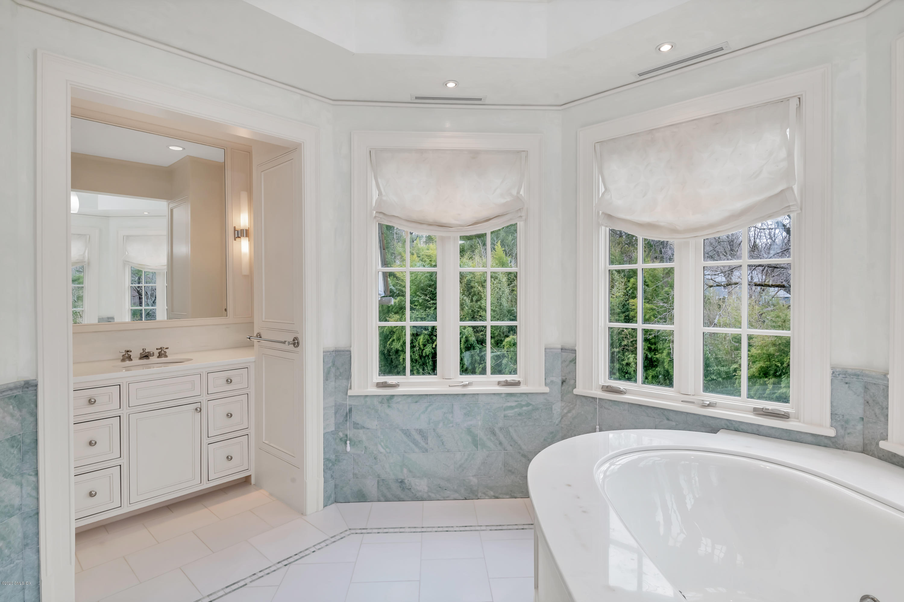 397 Riversville Road Greenwich, CT 06831 - Photo 12 of 21 a spacious bathroom with double vanity and a large mirror