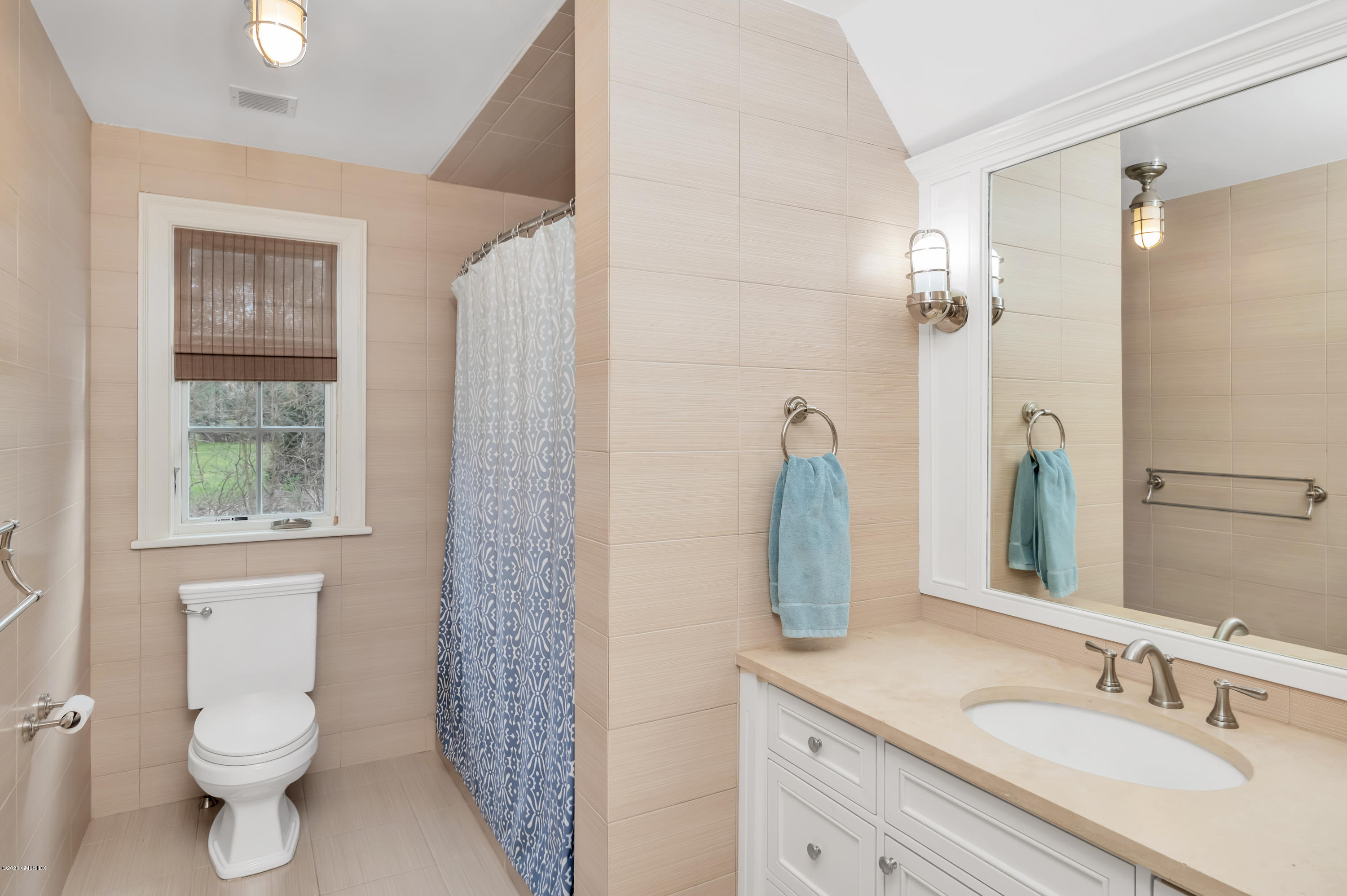 397 Riversville Road Greenwich, CT 06831 - Photo 13 of 21 a bathroom with a sink toilet a mirror and shower