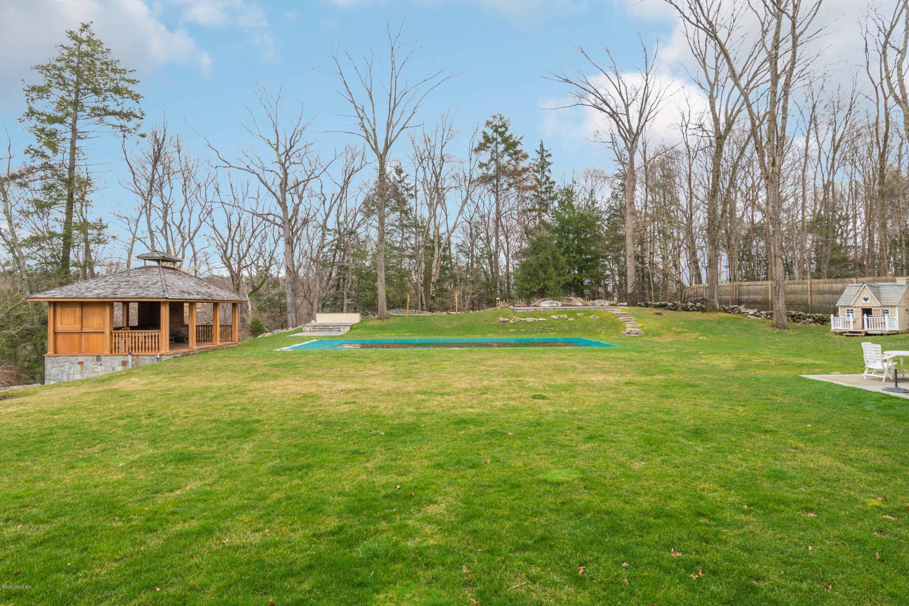 397 Riversville Road Greenwich, CT 06831 - Photo 16 of 21 a view of a house with a big yard