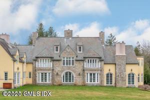 397 Riversville Road Greenwich, CT 06831 - Photo 17 of 21 a view of a large building with a big yard