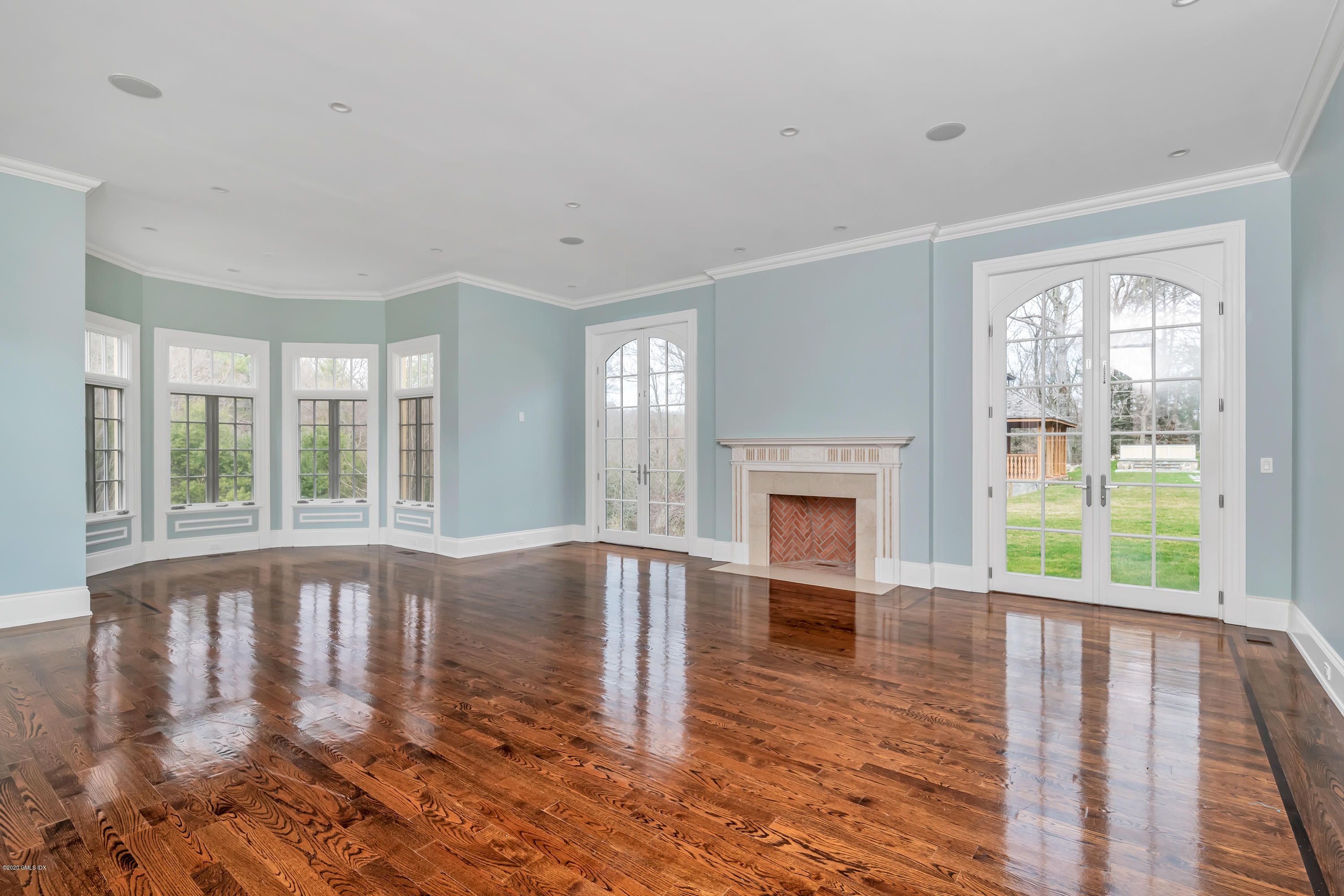 397 Riversville Road Greenwich, CT 06831 - Photo 3 of 21 a view of an empty room with wooden floor and a window