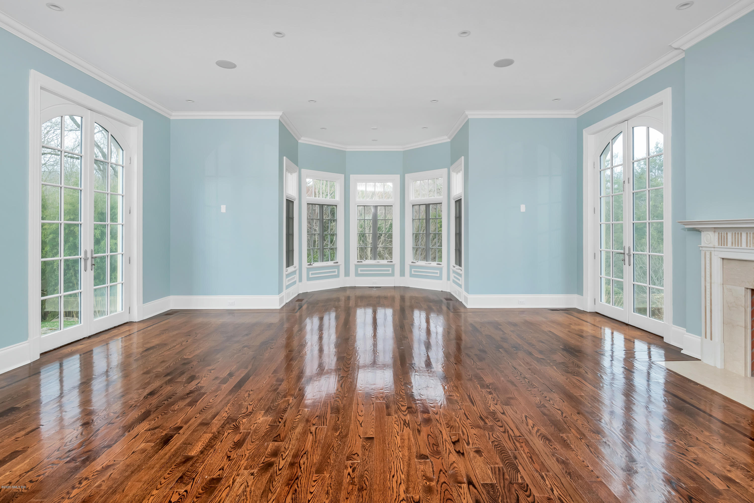 397 Riversville Road Greenwich, CT 06831 - Photo 4 of 21 a view of empty room with wooden floor and fan