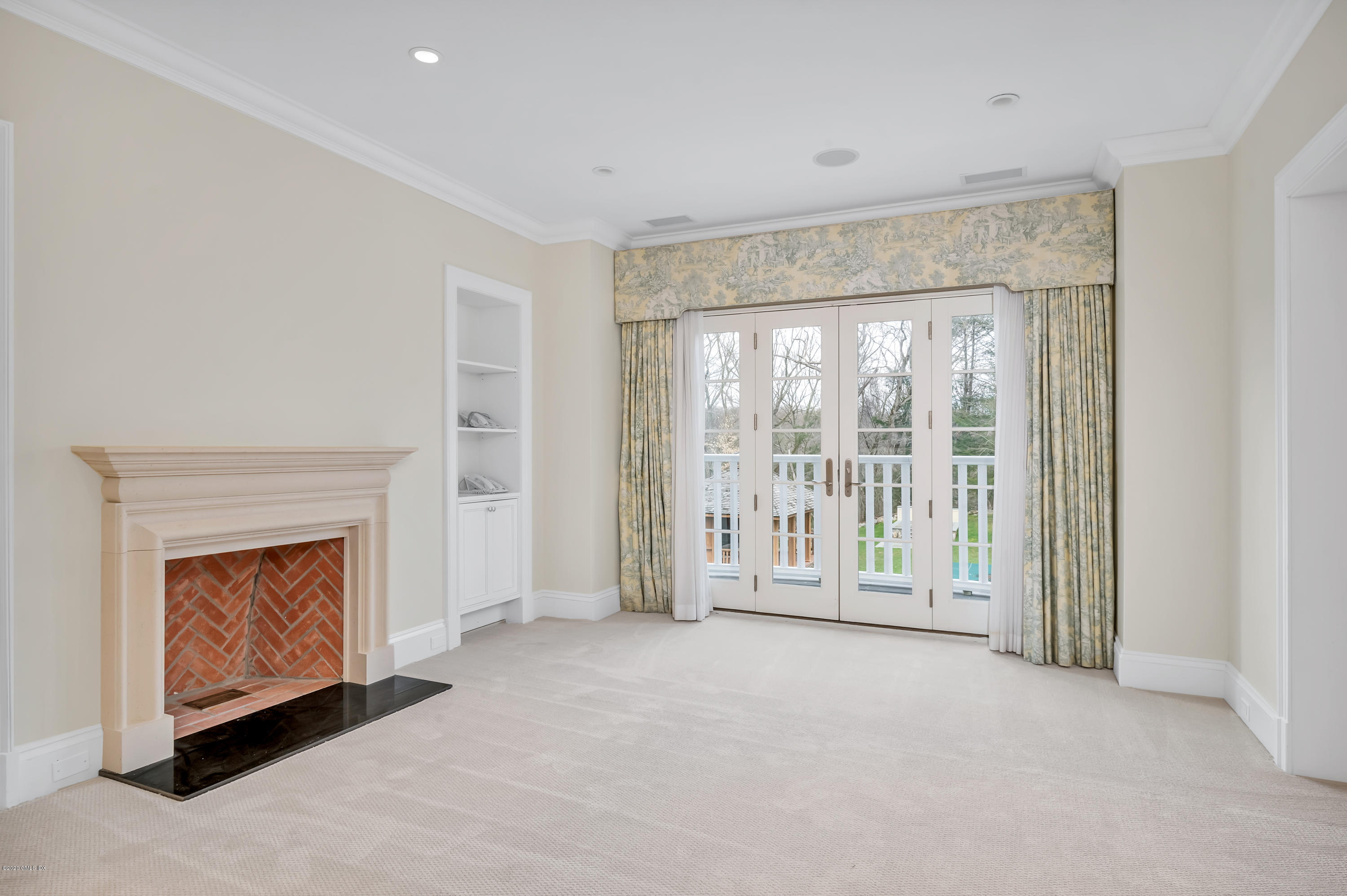 397 Riversville Road Greenwich, CT 06831 - Photo 8 of 21 a view of an empty room with a fireplace