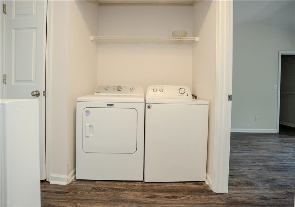 4645 Valais Court, Unit 109 Alpharetta, GA 30022 - Photo 15 of 27 a utility room with dryer and washer