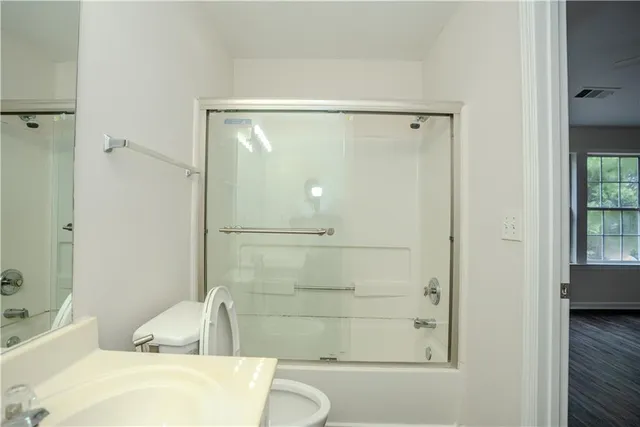 a bathroom with a bathtub and shower