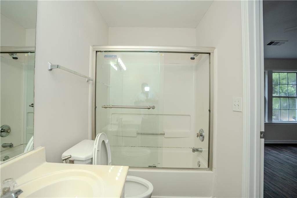4645 Valais Court, Unit 109 Alpharetta, GA 30022 - Photo 20 of 27 a bathroom with a bathtub and shower