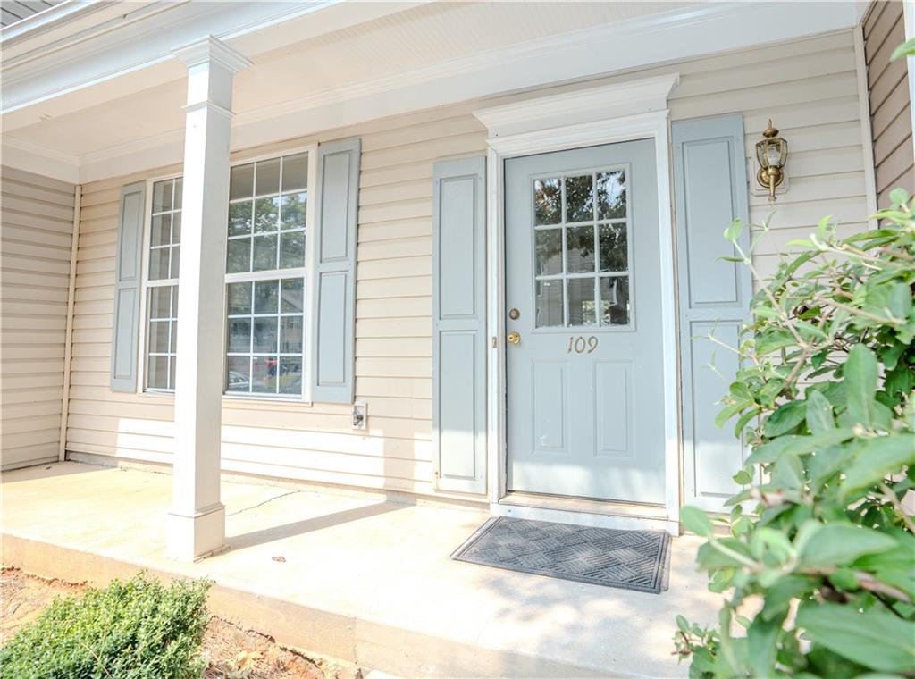 4645 Valais Court, Unit 109 Alpharetta, GA 30022 - Photo 3 of 27 a view of a door with a outdoor space