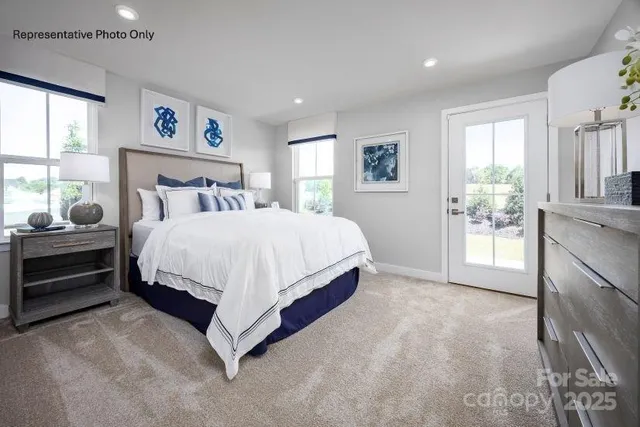 a bedroom with a bed and a cabinets