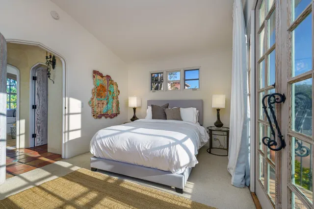 a living room with patio furniture and a fireplace