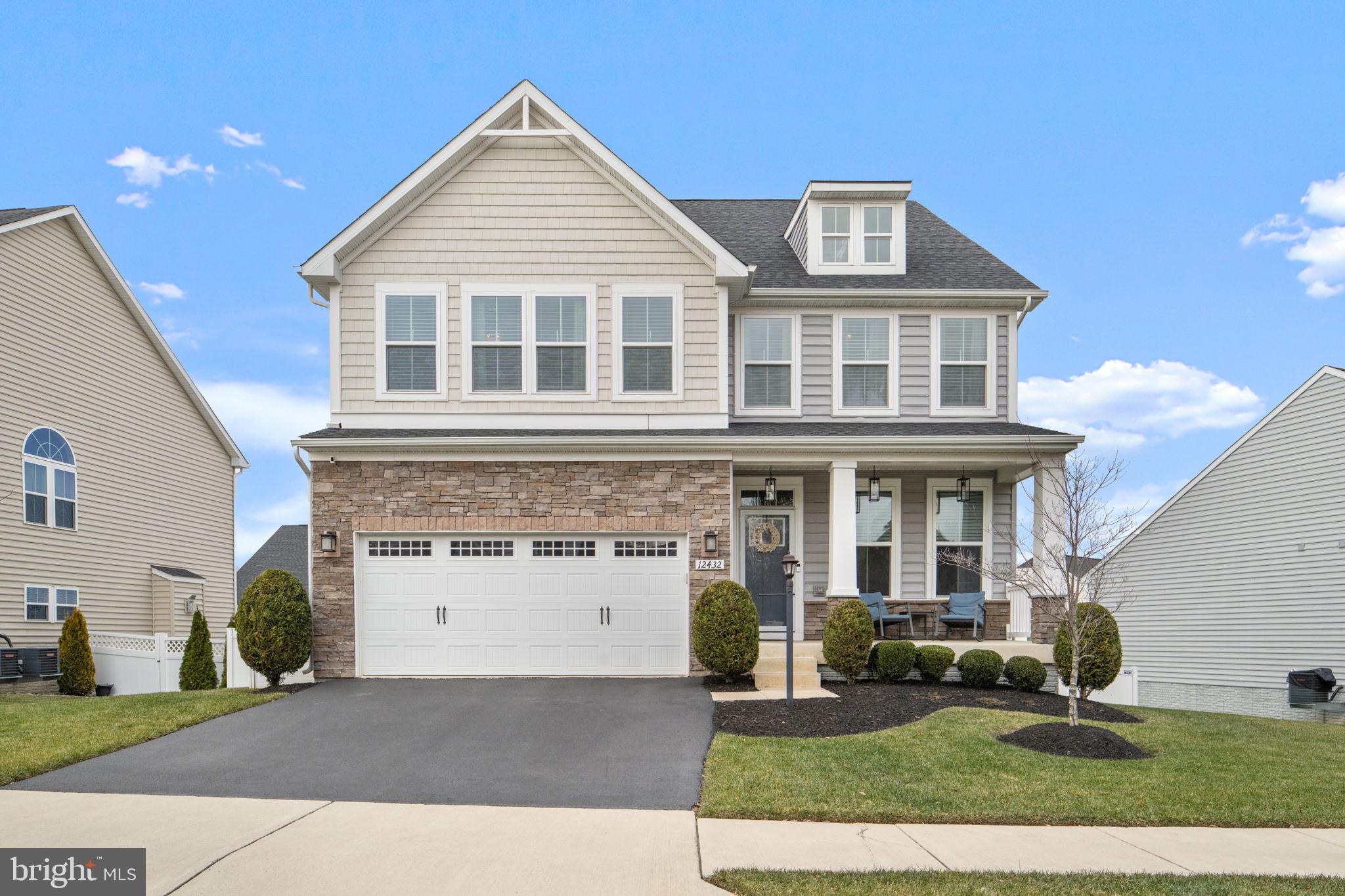 12432 Mays Quarter Road Woodbridge, VA 22192 - Photo 1 of 94 a front view of a house with a yard