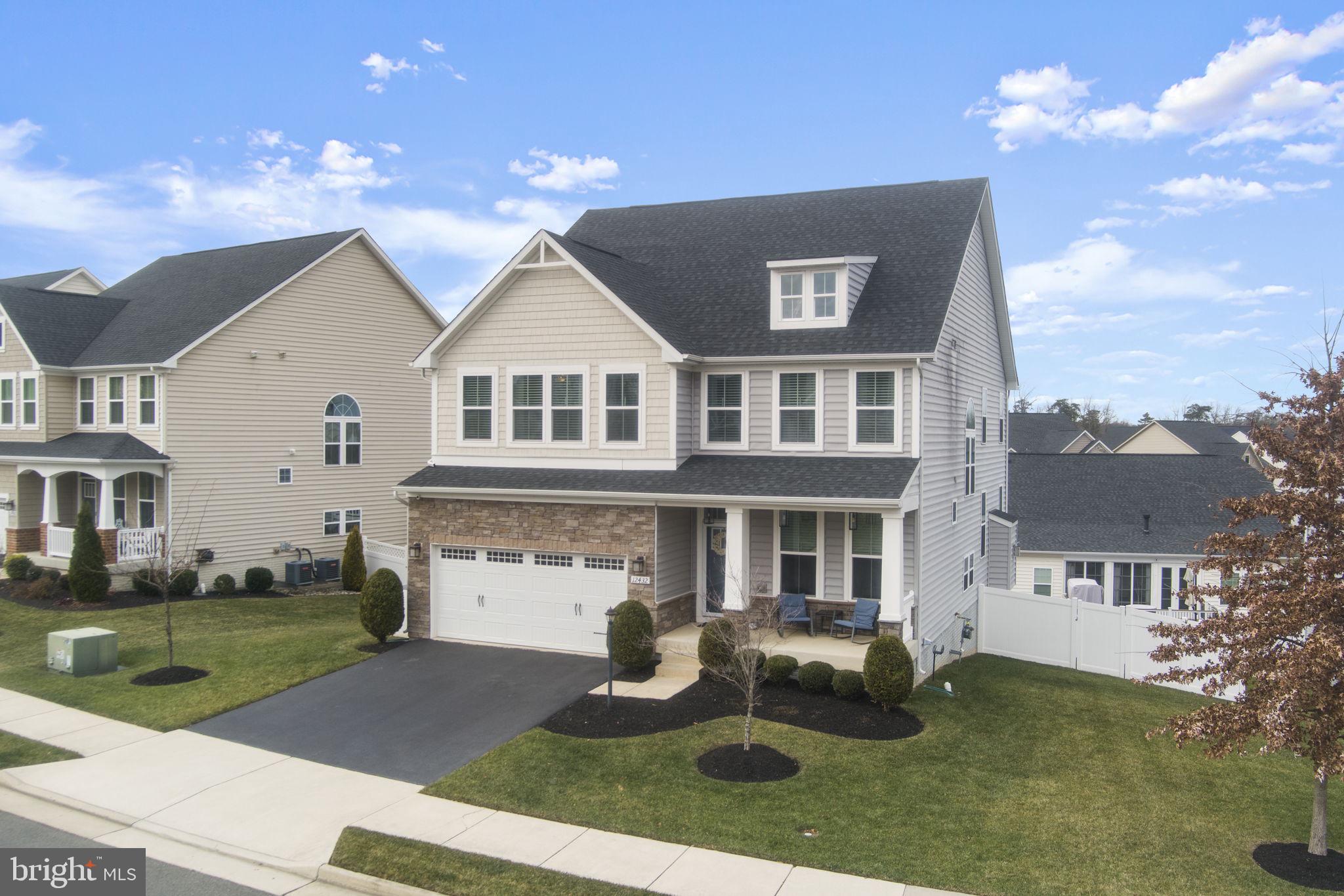 12432 Mays Quarter Road Woodbridge, VA 22192 - Photo 3 of 94 a front view of a house with garden