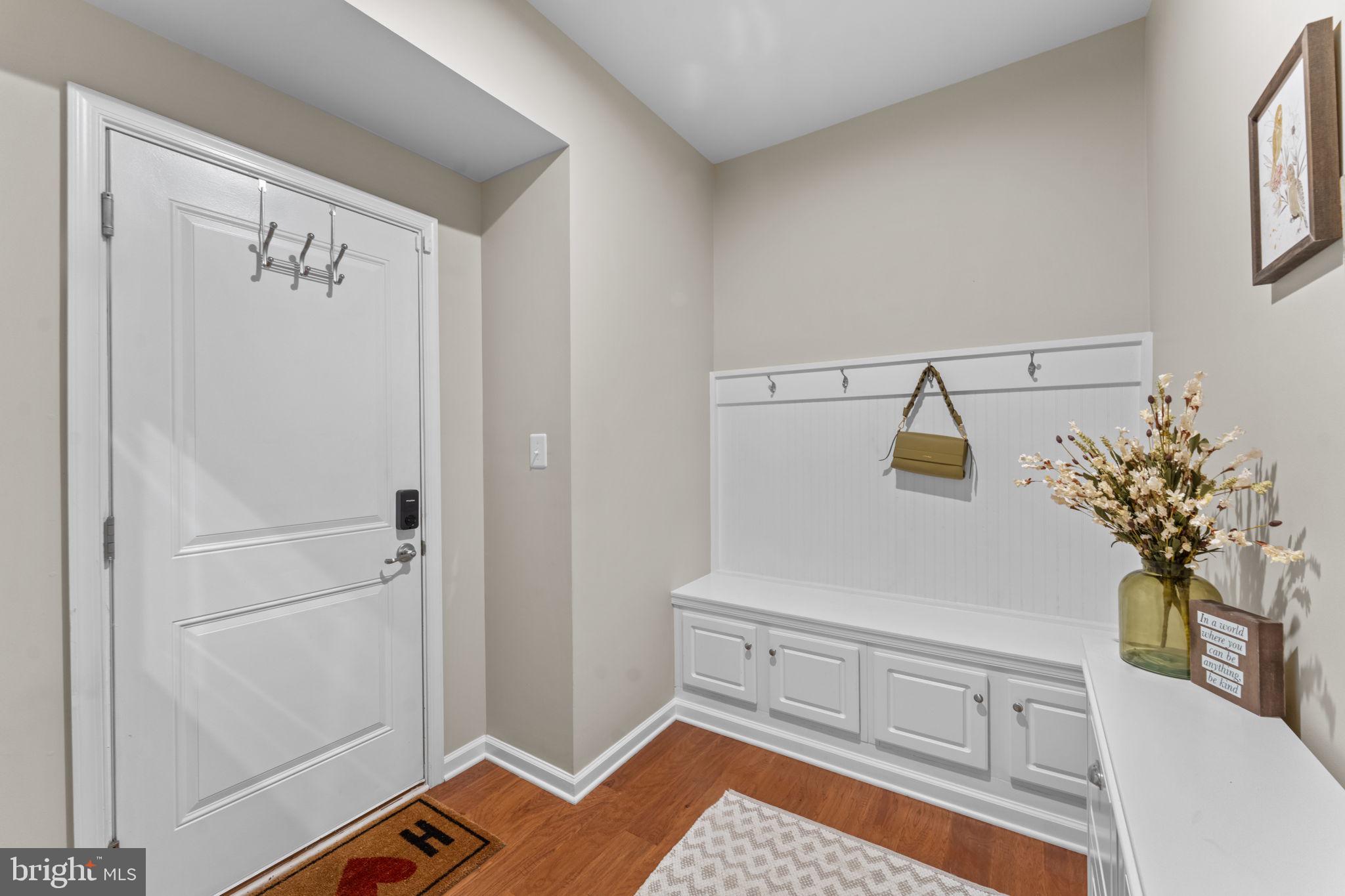 12432 Mays Quarter Road Woodbridge, VA 22192 - Photo 32 of 94 a view of a bedroom with wooden floor and cabinet
