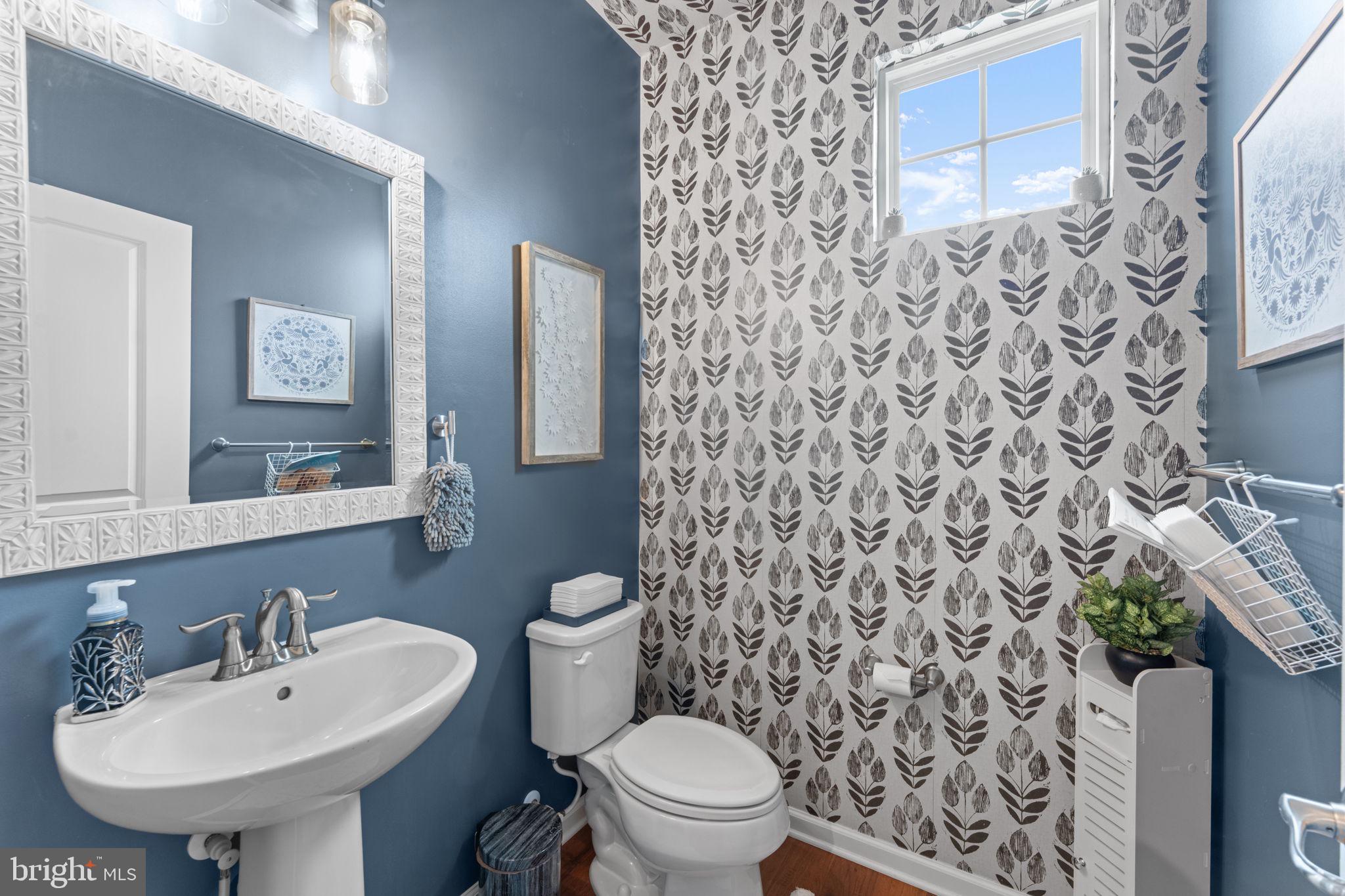 12432 Mays Quarter Road Woodbridge, VA 22192 - Photo 33 of 94 a bathroom with a sink toilet and mirror