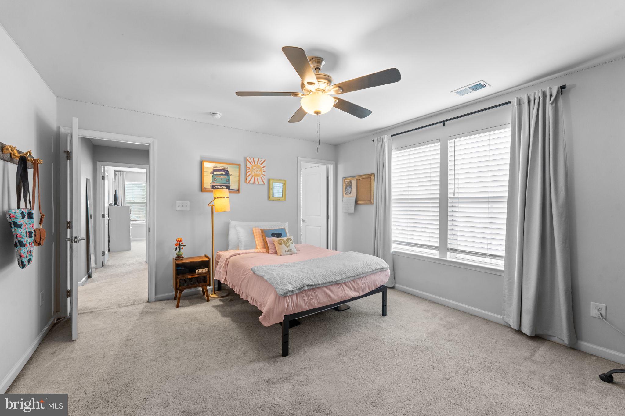 12432 Mays Quarter Road Woodbridge, VA 22192 - Photo 47 of 94 a living room with a bed furniture and a window