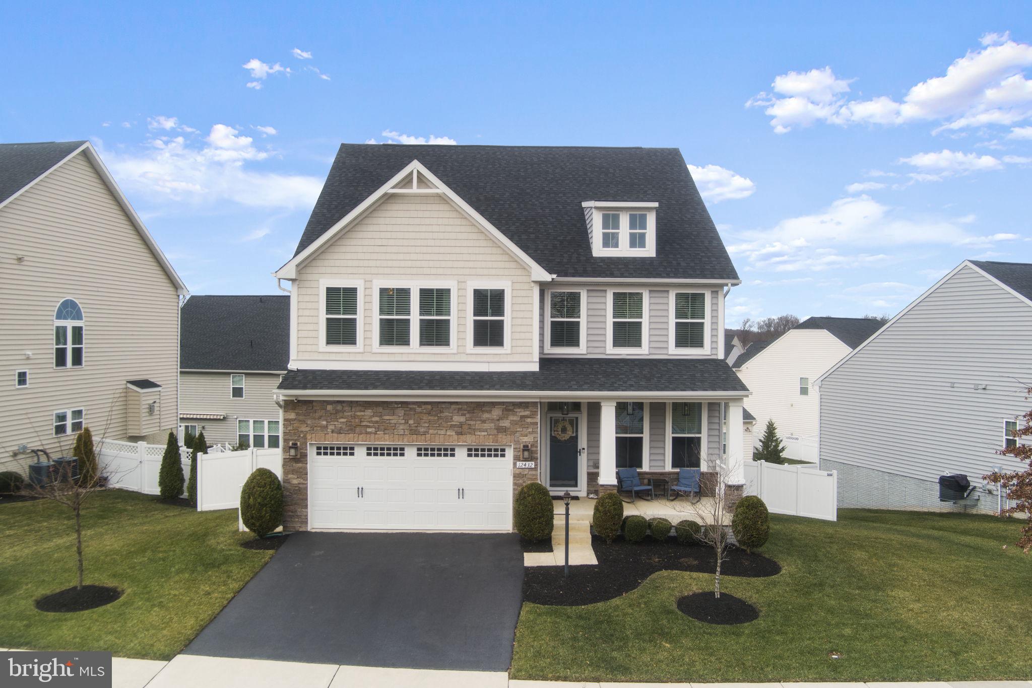 12432 Mays Quarter Road Woodbridge, VA 22192 - Photo 6 of 94 a front view of a house with a yard