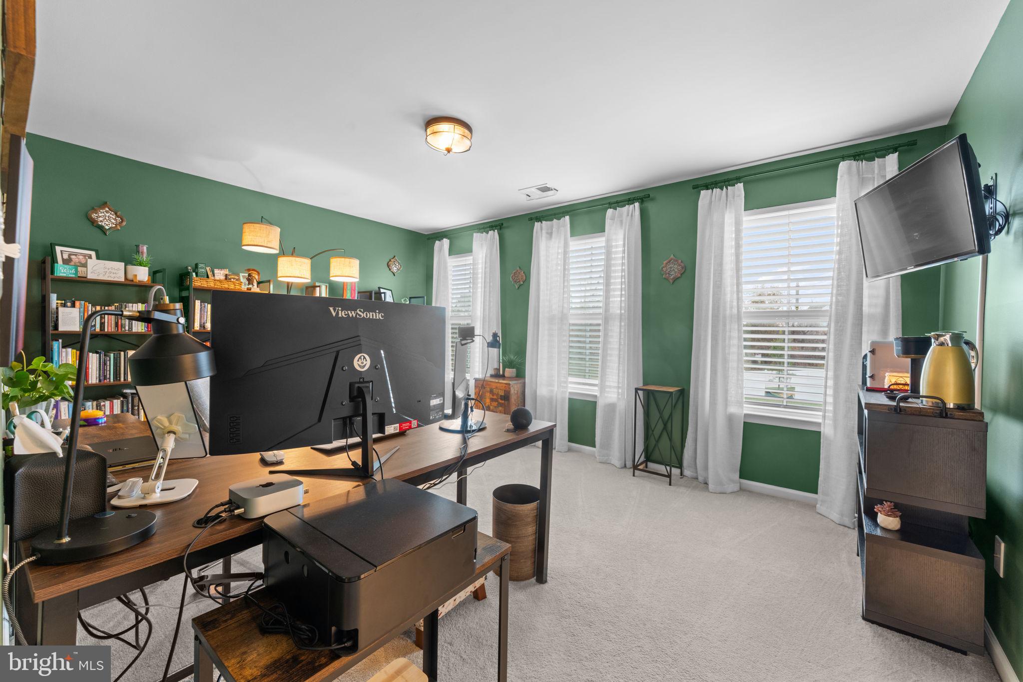 12432 Mays Quarter Road Woodbridge, VA 22192 - Photo 73 of 94 a view of a workspace with furniture and a window